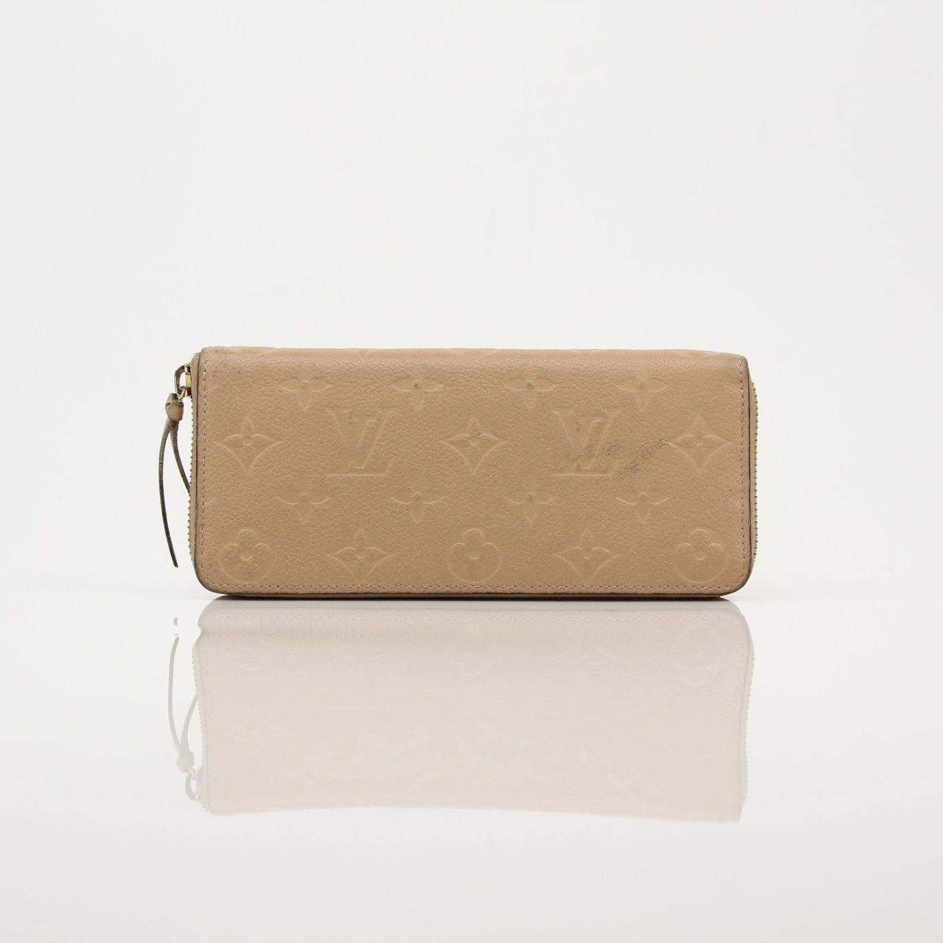 Louis Vuitton Empreinte Clemence wallet with gold-tone hardware and embossed leather, featuring multiple card slots and a compact design.