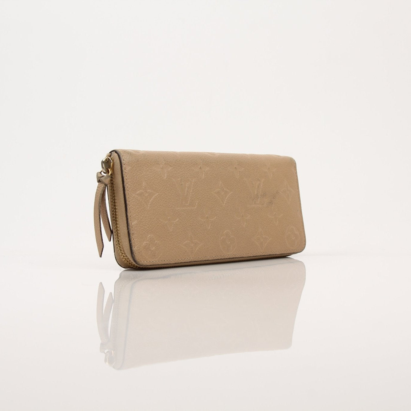 Louis Vuitton Empreinte Clemence wallet with gold hardware, showcasing textured leather and multiple card slots.