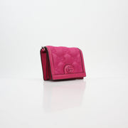 Gucci Fuchsia GG Matelassé Mini Wallet on Chain with gold hardware, compact design, and quilted leather details.
