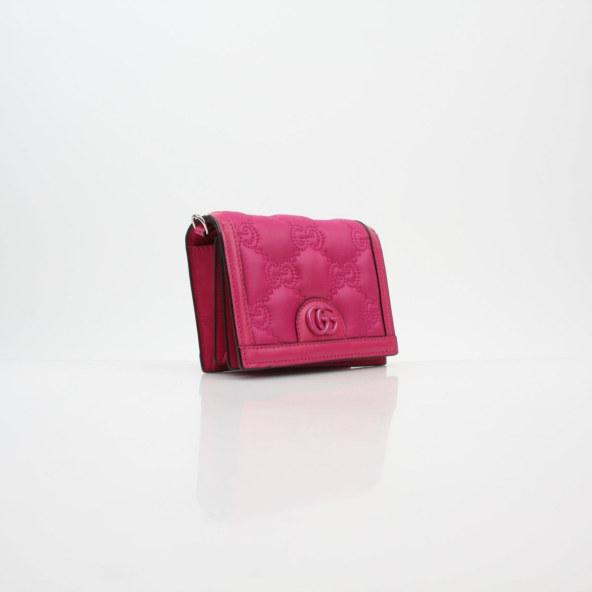 Gucci Fuchsia GG Matelassé Mini Wallet on Chain with gold hardware, compact design, and quilted leather details.