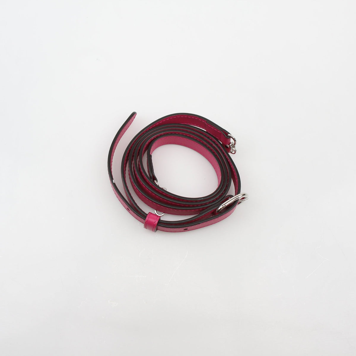 Gucci fuchsia GG matelassé mini wallet on chain with gold hardware, showcasing quilted leather and compact design.
