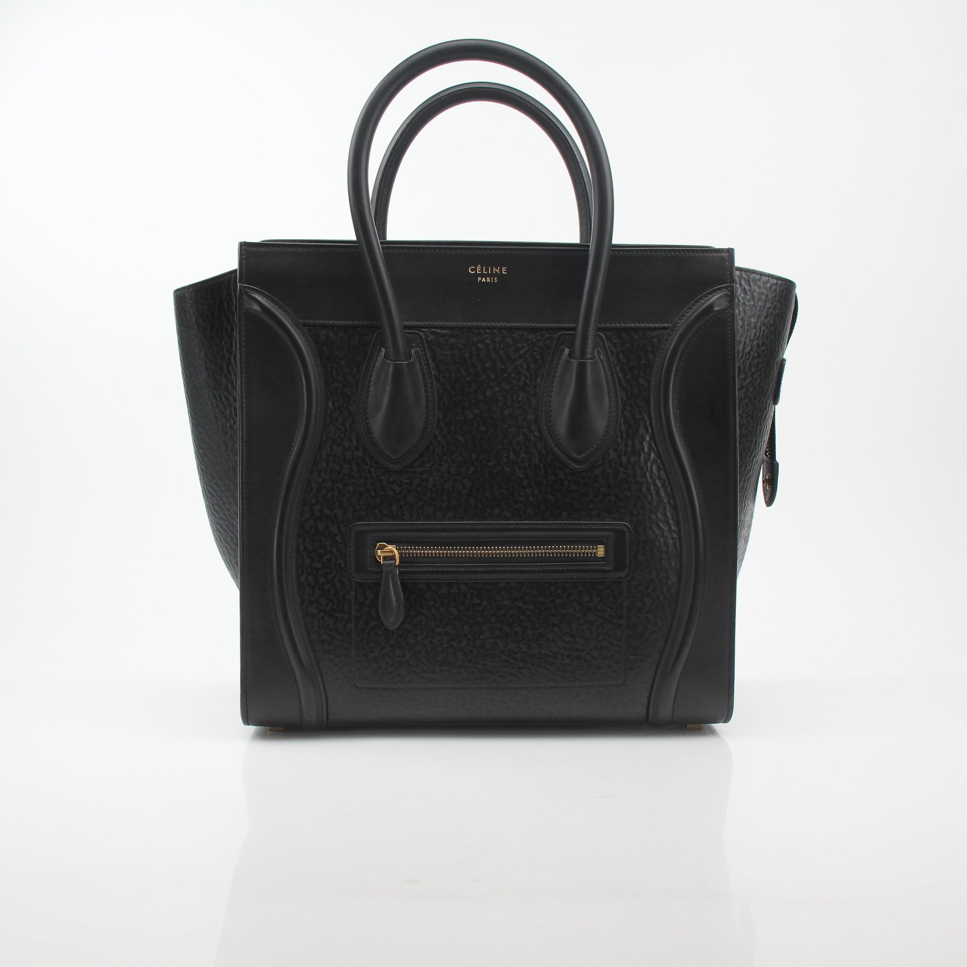 Black Celine luggage tote handbag by Gold & Beyond with structured design and top handles, showcasing its sleek, sophisticated style.