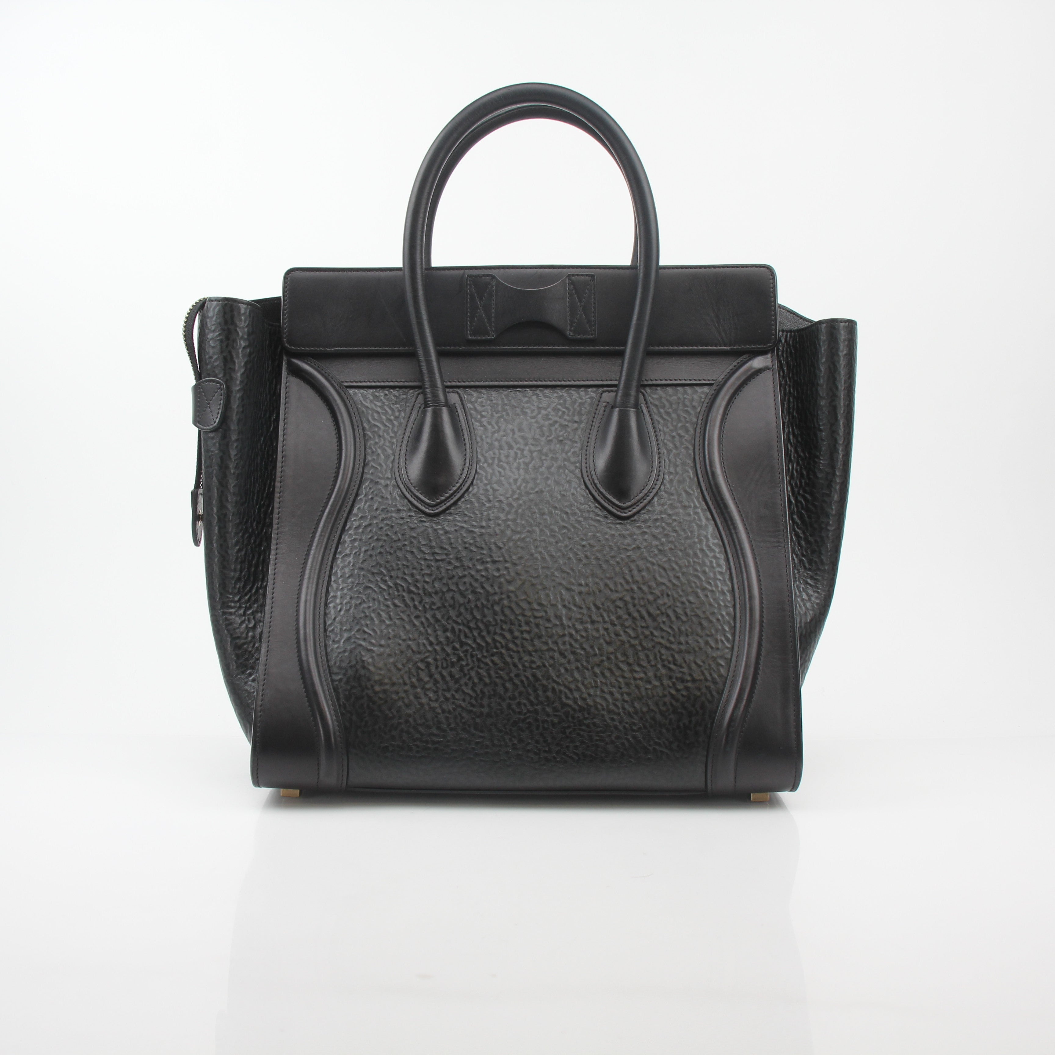 Gold & Beyond Celine black luggage tote handbag with sturdy handles and spacious interior, stylish travel accessory.