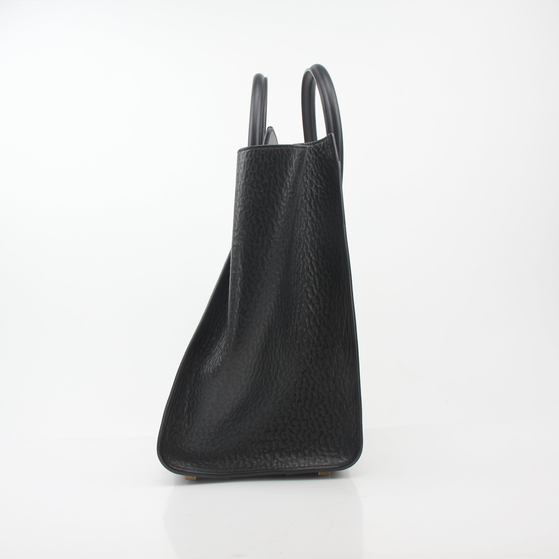 Black Celine luggage tote handbag by Gold & Beyond, featuring structured design, twin top handles, and gold-tone hardware.