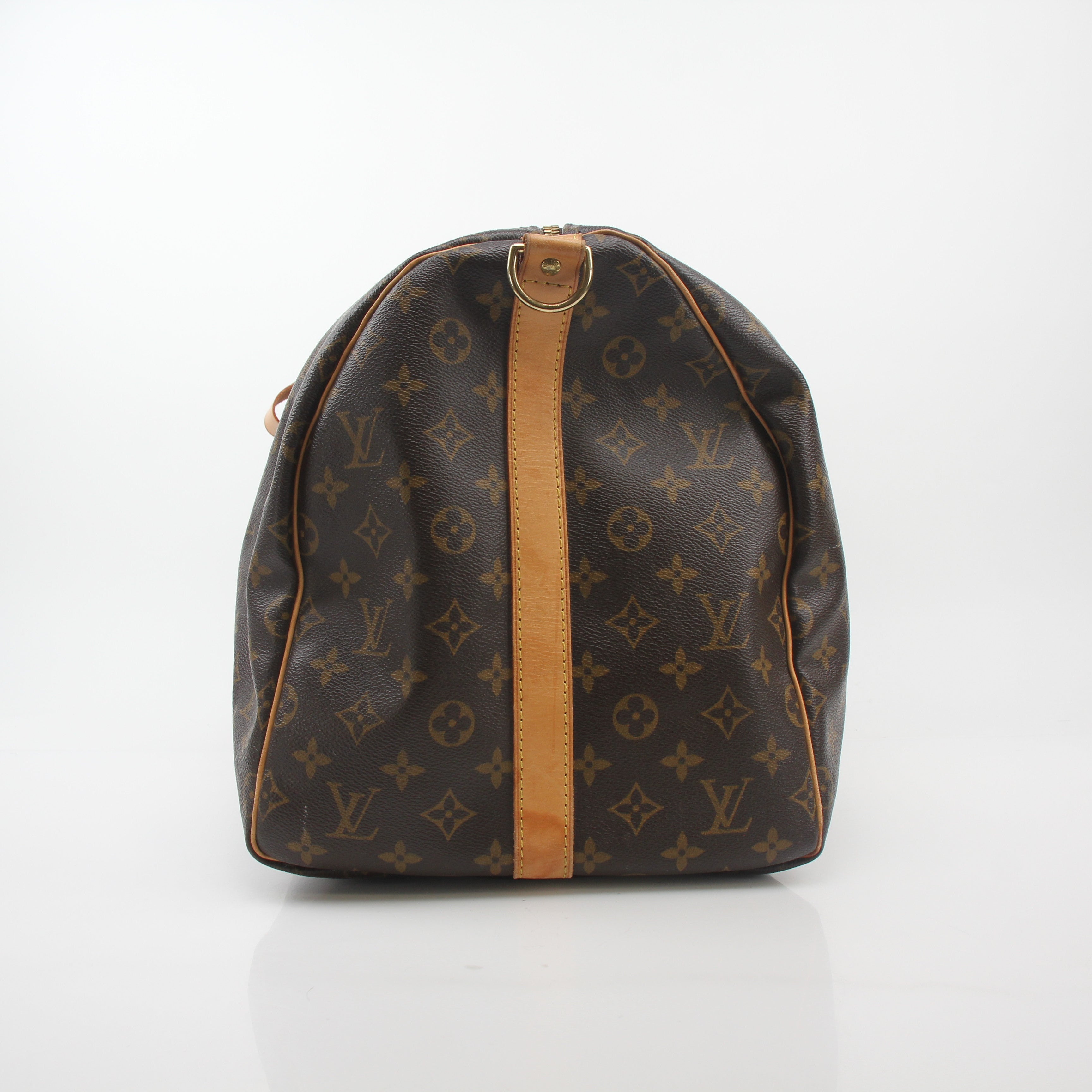 Louis Vuitton Monogram Keepall Bandoulière 55 duffel bag with leather trim and gold hardware, designed for travel and carry-on use.