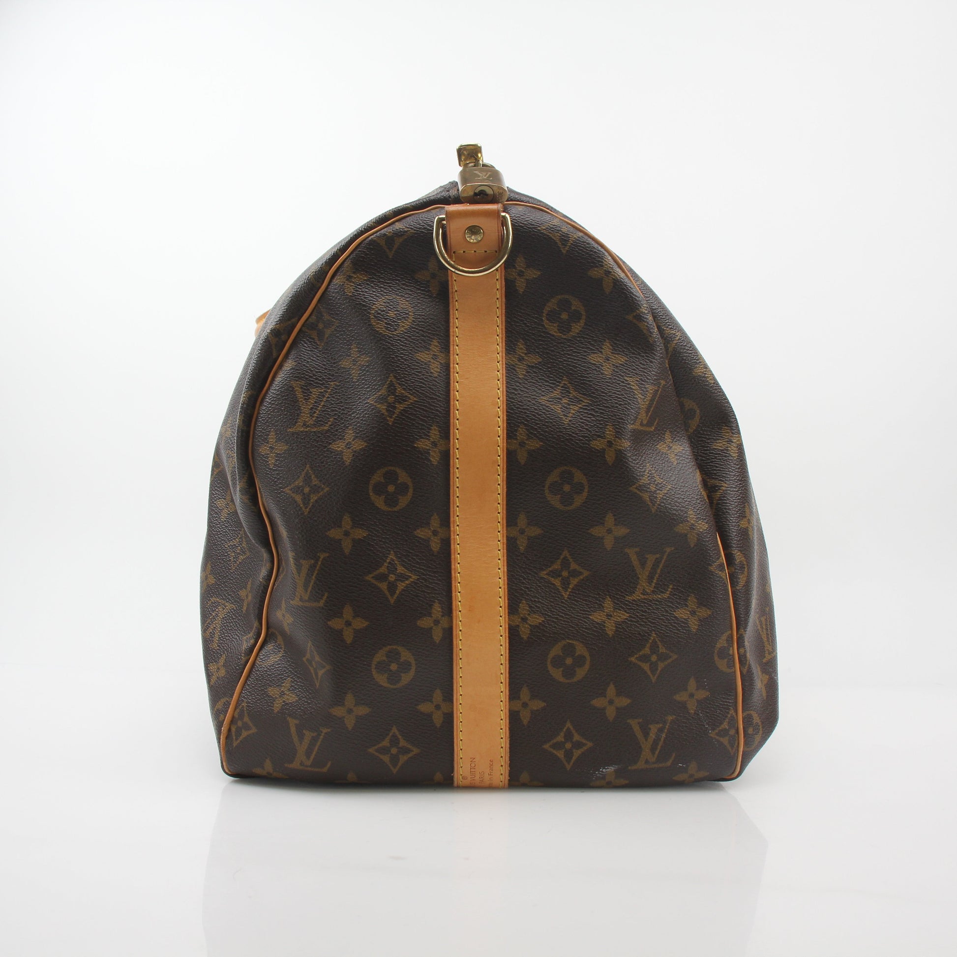 Louis Vuitton Monogram Keepall Bandoulière 55 duffel bag with leather handles and gold hardware, designed for travel and style.