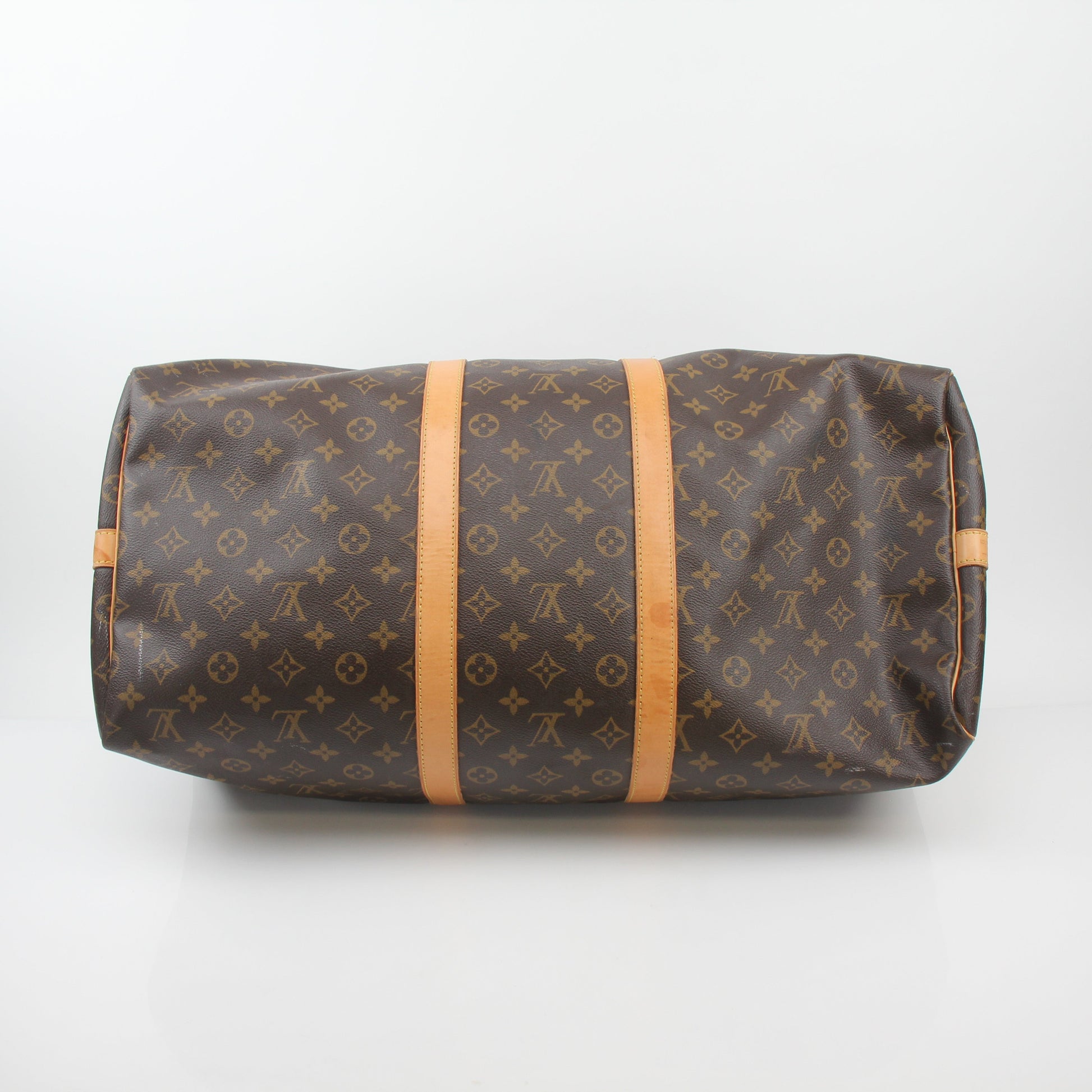 Louis Vuitton Monogram Keepall Bandoulière 55 duffel bag with leather trim and gold-tone hardware, designed for travel and style.
