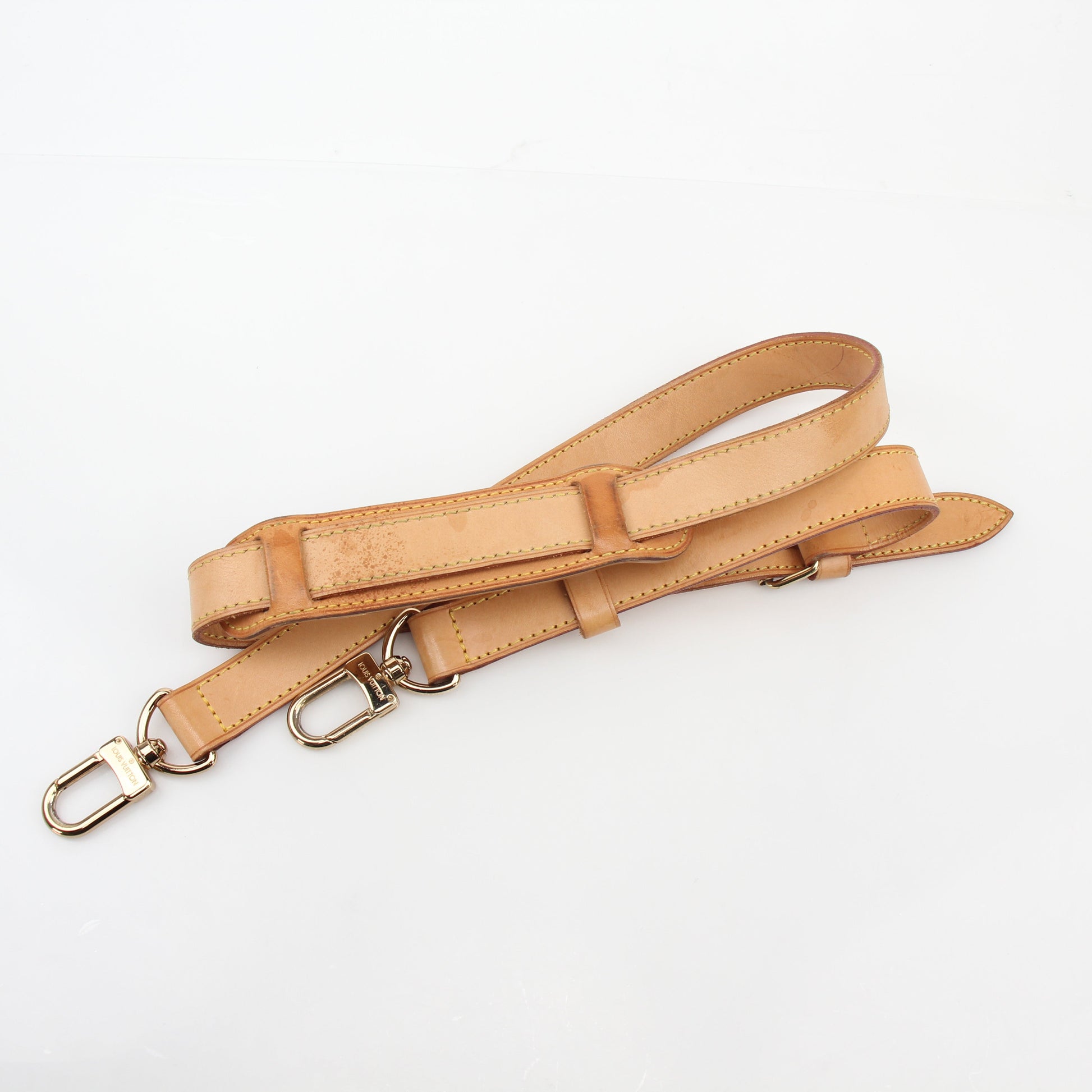 Louis Vuitton Monogram Keepall Bandoulière 55 duffel bag with leather handles and gold-tone hardware, designed for travel and weekend trips.
