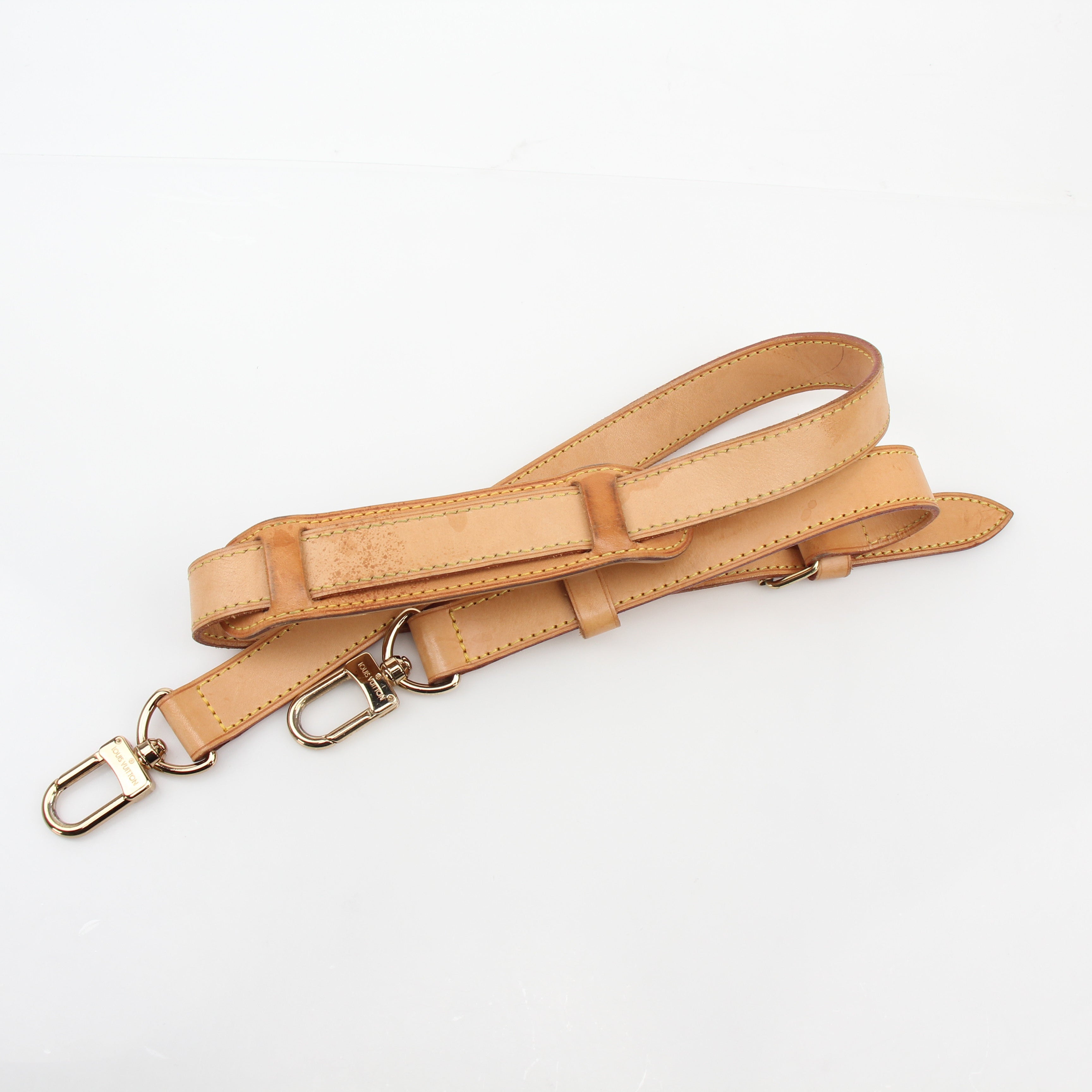 Louis Vuitton Monogram Keepall Bandoulière 55 duffel bag with leather handles and gold-tone hardware, designed for travel and weekend trips.