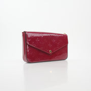 Louis Vuitton Red Monogram Vernis Félicie Pochette handbag with gold accents, glossy finish, and compact design.