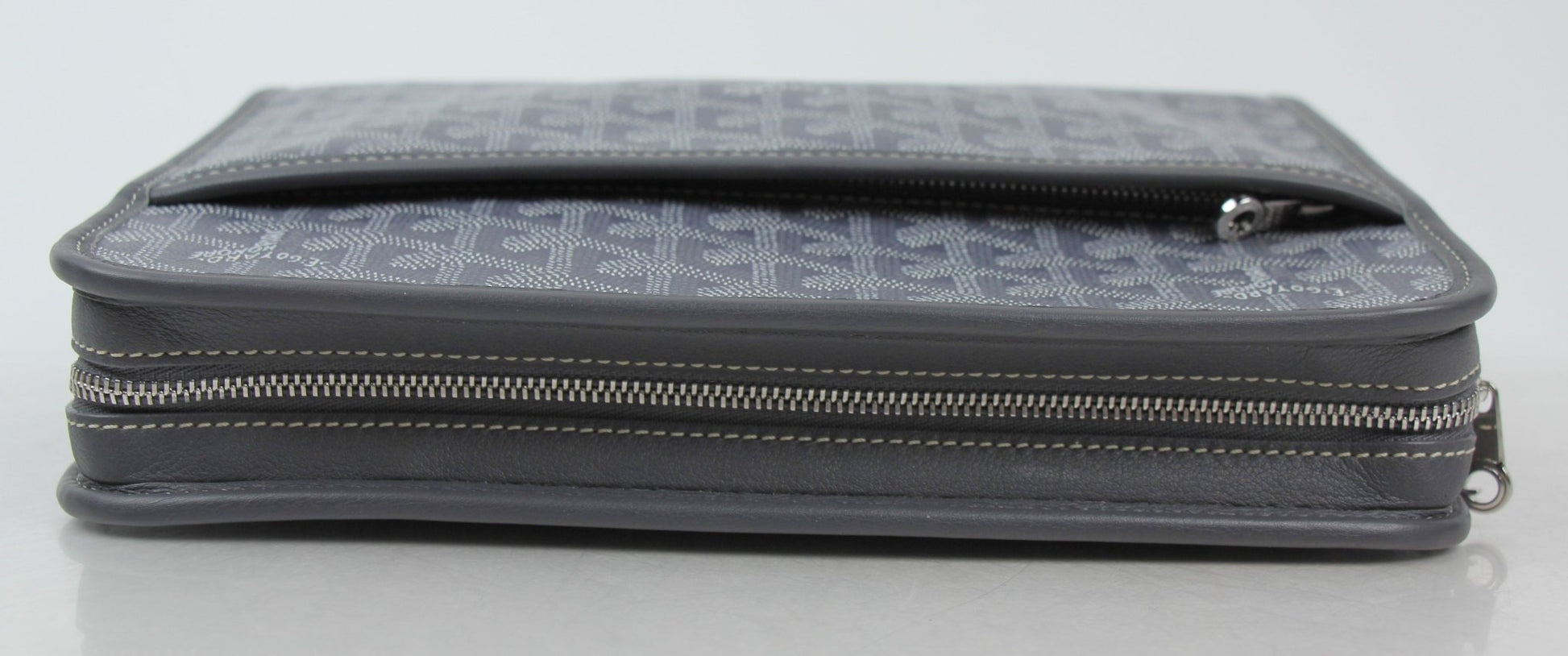 Goyard Jouvence PM Toiletry Pouch in luxury travel bag, with gold accents and compact design for organizing toiletries.