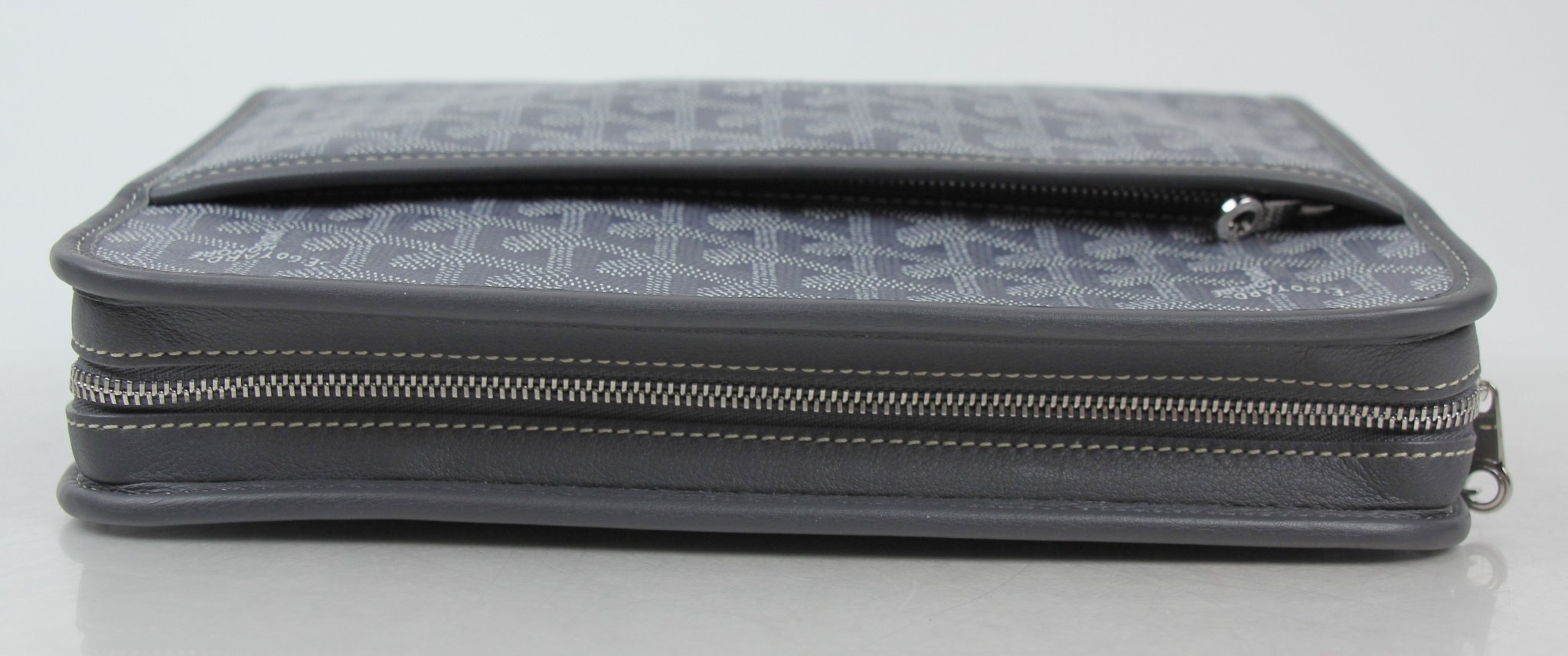 Goyard Jouvence PM Toiletry Pouch in luxury travel bag, with gold accents and compact design for organizing toiletries.