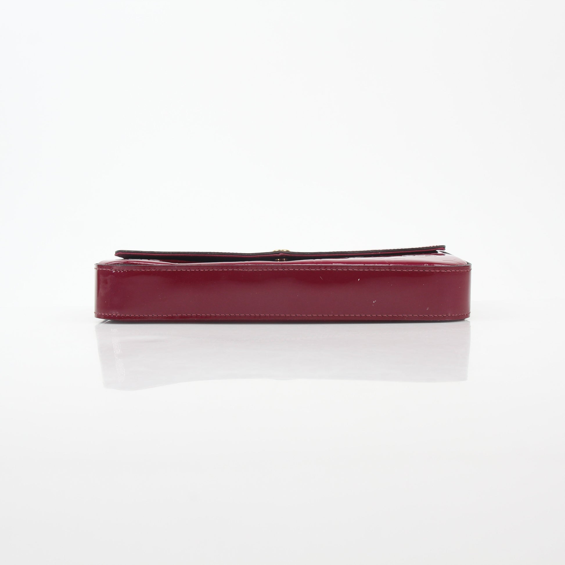 Louis Vuitton Red Monogram Vernis Pochette Félicie handbag with gold accents, glossy finish, and compact design.