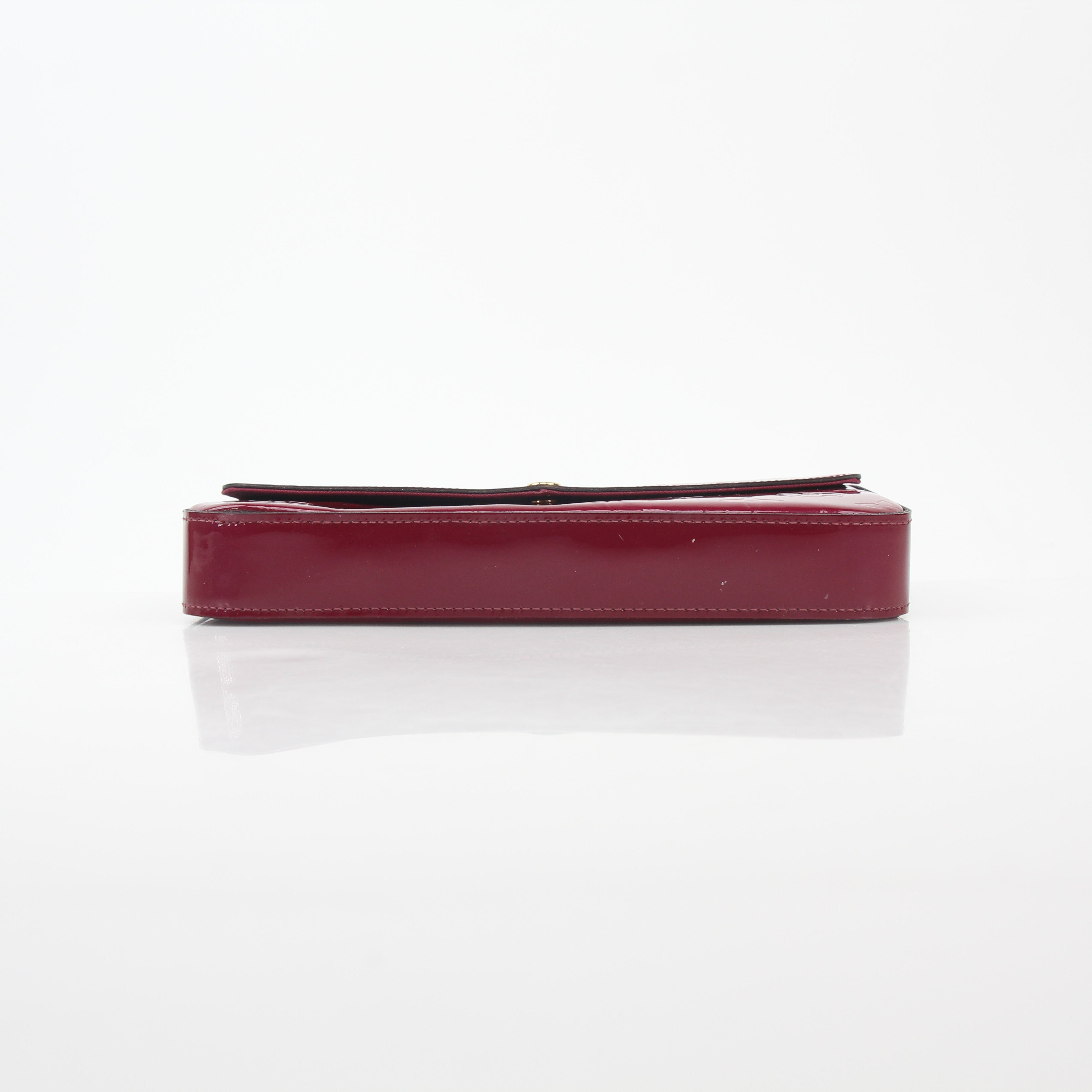 Louis Vuitton Red Monogram Vernis Pochette Félicie handbag with gold accents, glossy finish, and compact design.