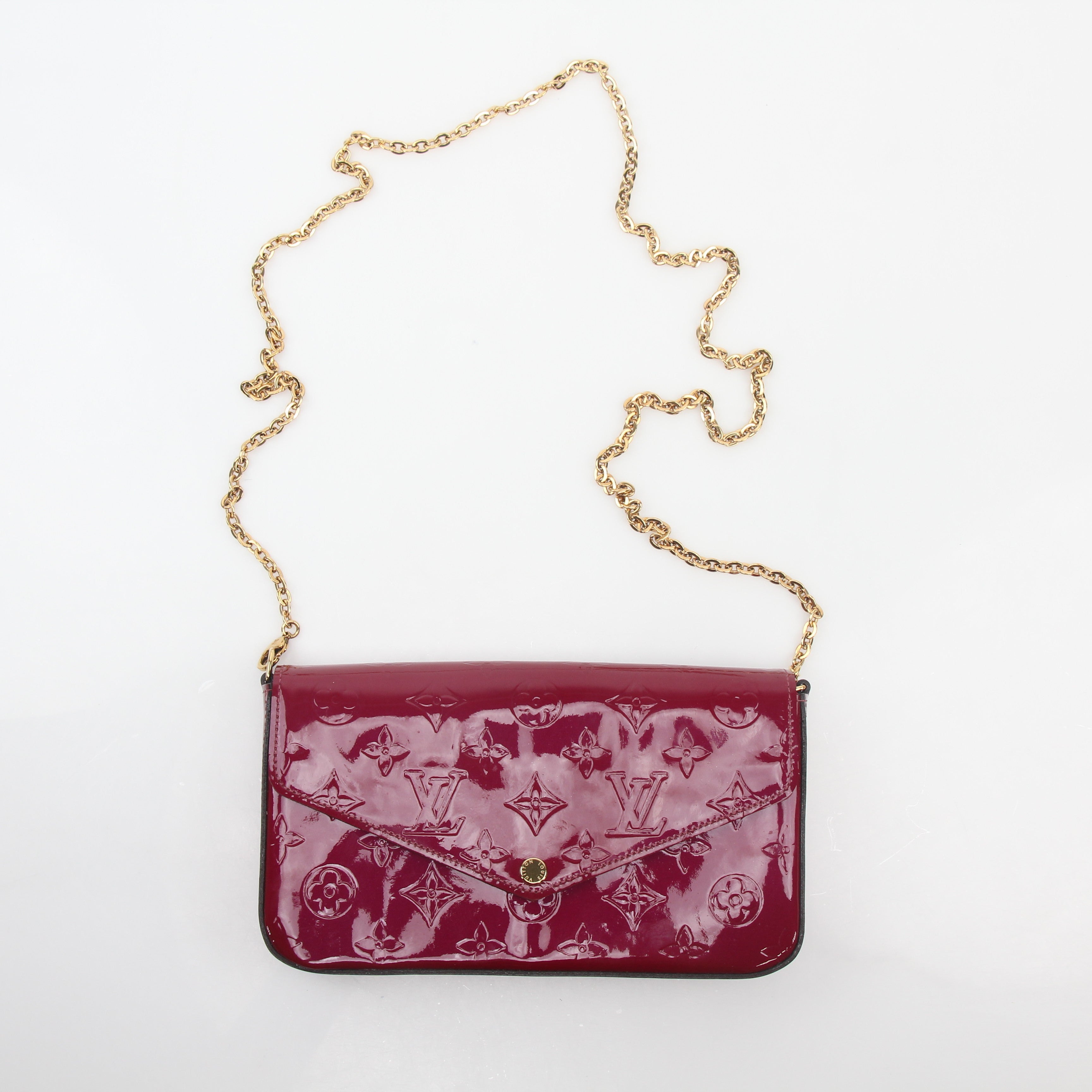 Louis Vuitton Red Monogram Vernis Pochette Félicie handbag with gold hardware, glossy leather, and compact design.