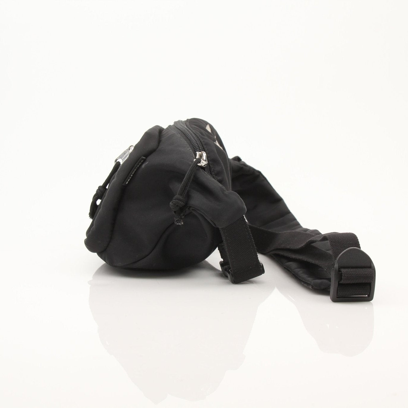 Balenciaga WFP nylon belt bag with adjustable strap, black color, featuring logo details and compact handbag design.