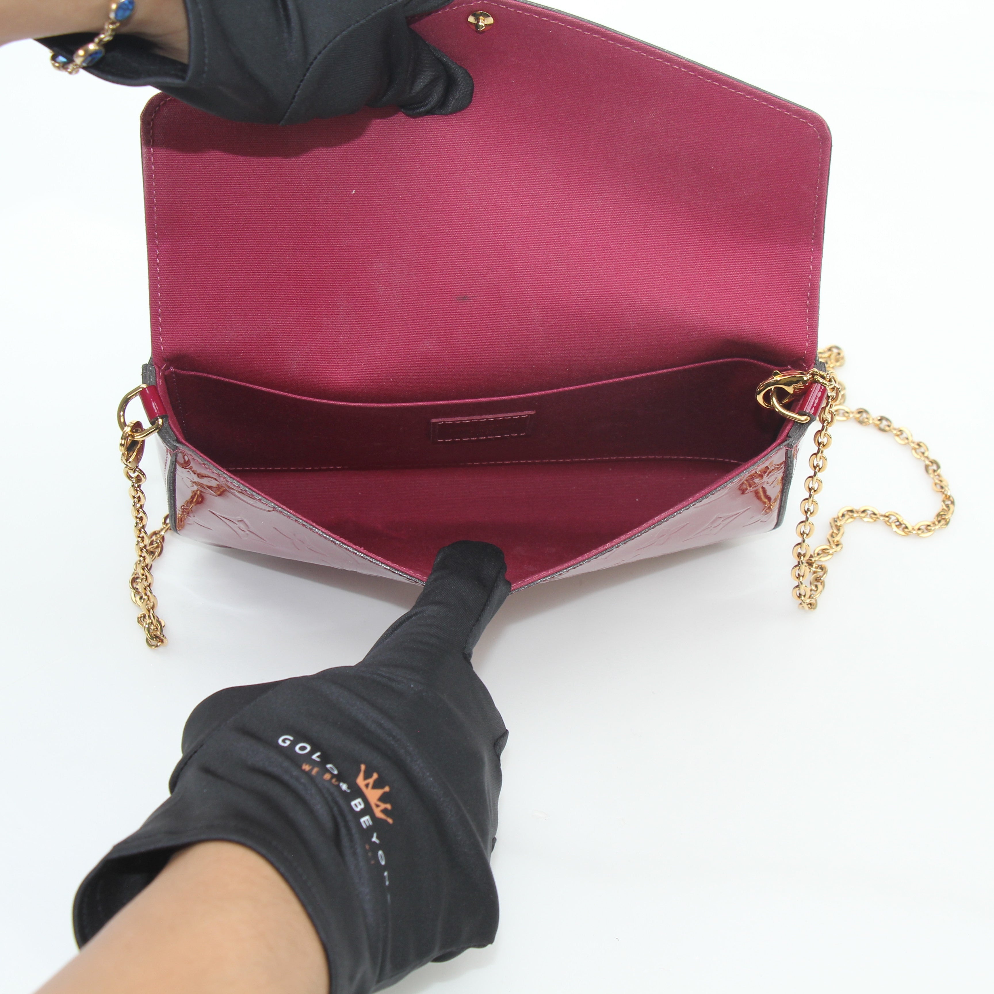 Louis Vuitton Red Monogram Vernis Félicie handbag with gold-tone hardware, glossy finish, and signature monogram pattern.