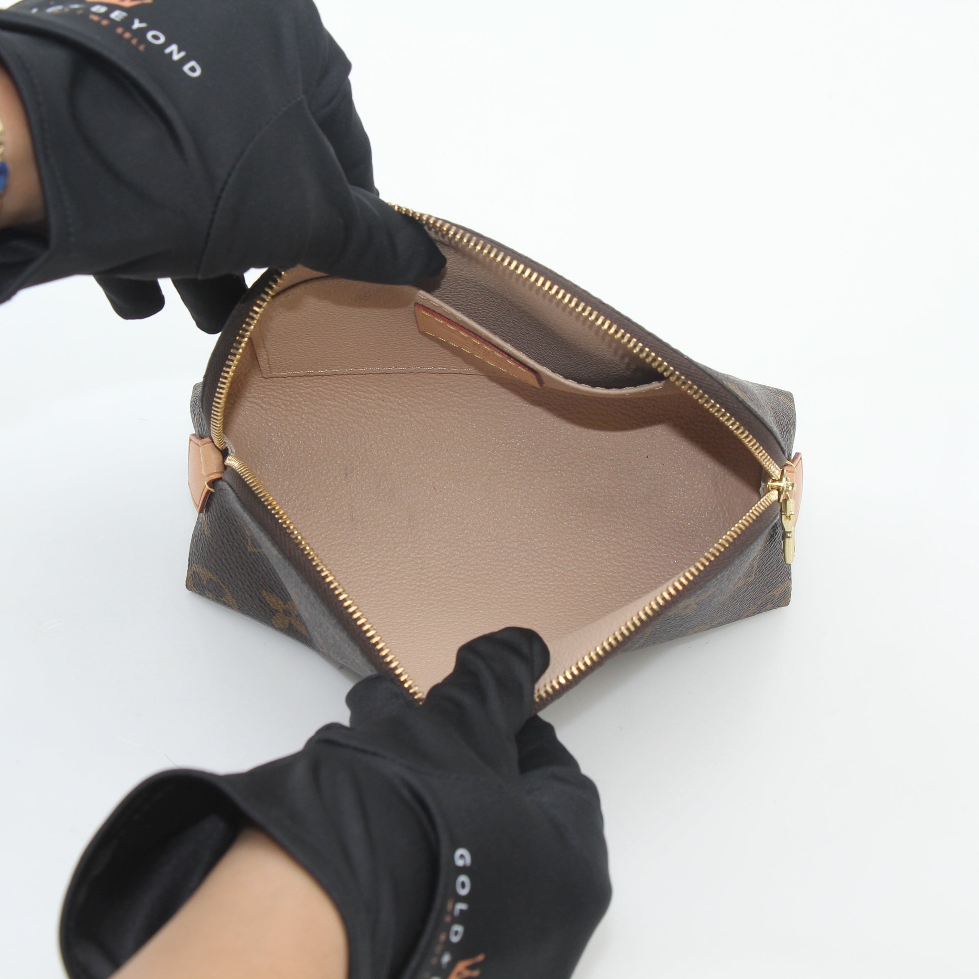Louis Vuitton Monogram Cosmetic Pouch vanity case with gold accents and zipper closure, featuring the signature monogram canvas design.