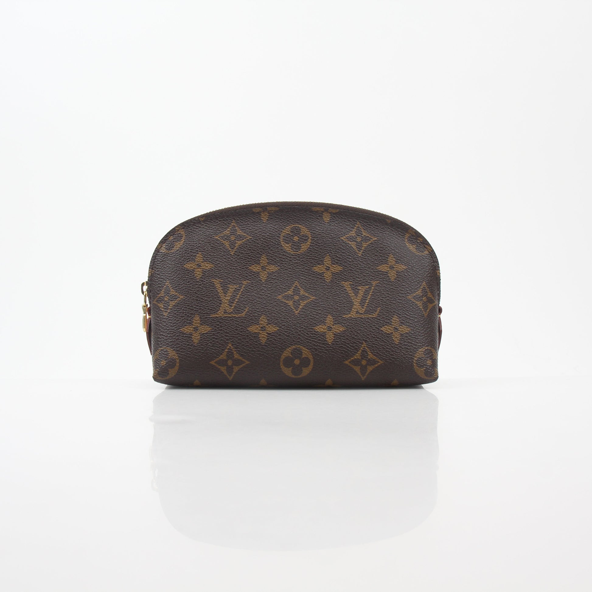 Louis Vuitton Monogram Cosmetic Pouch vanity case with gold accents and zipped closure, featuring iconic LV monogram pattern.