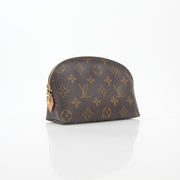 Louis Vuitton Monogram cosmetic pouch vanity case with gold accents, featuring the signature monogram pattern and zipper closure.
