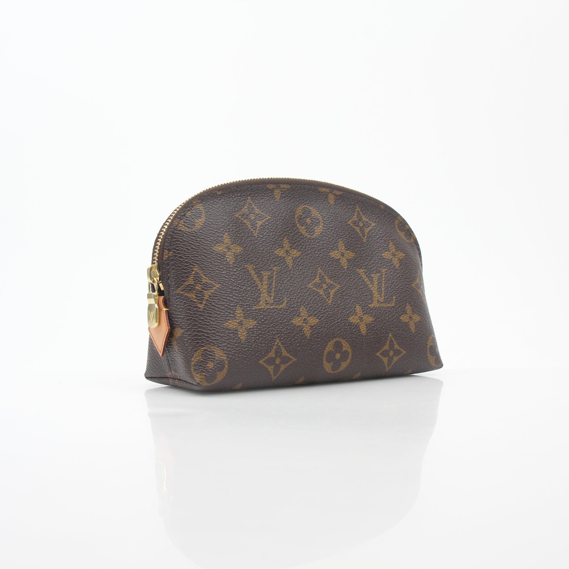 Louis Vuitton Monogram cosmetic pouch vanity case with gold accents, featuring the signature monogram pattern and zipper closure.
