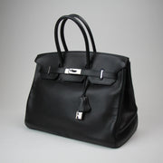 Hermès Birkin 35 handbag in elegant design, showcasing premium leather and gold hardware details.