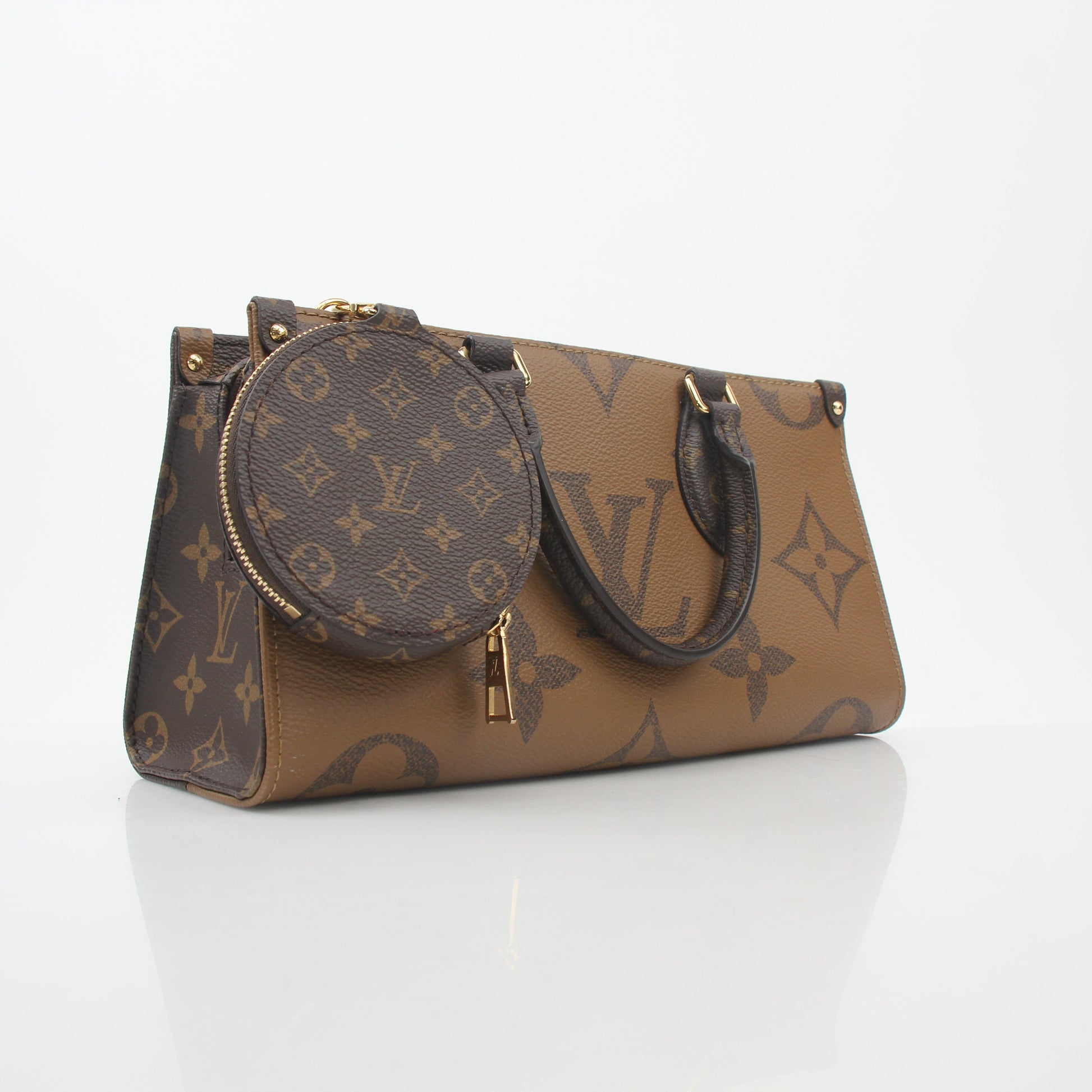 Louis Vuitton brown Monogram OnTheGo East West handbag with gold accents, featuring leather handles and spacious interior.
