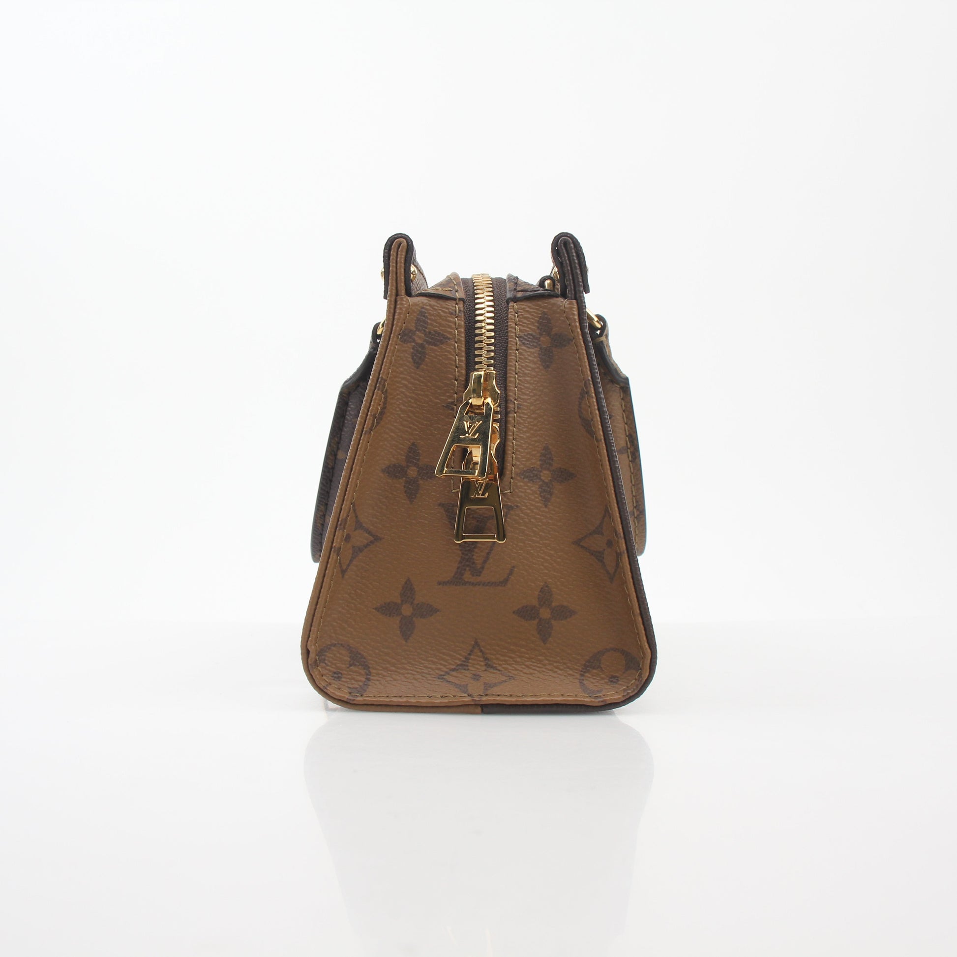 Louis Vuitton brown Monogram OnTheGo East West handbag with gold-tone hardware, featuring a spacious design and top handles.