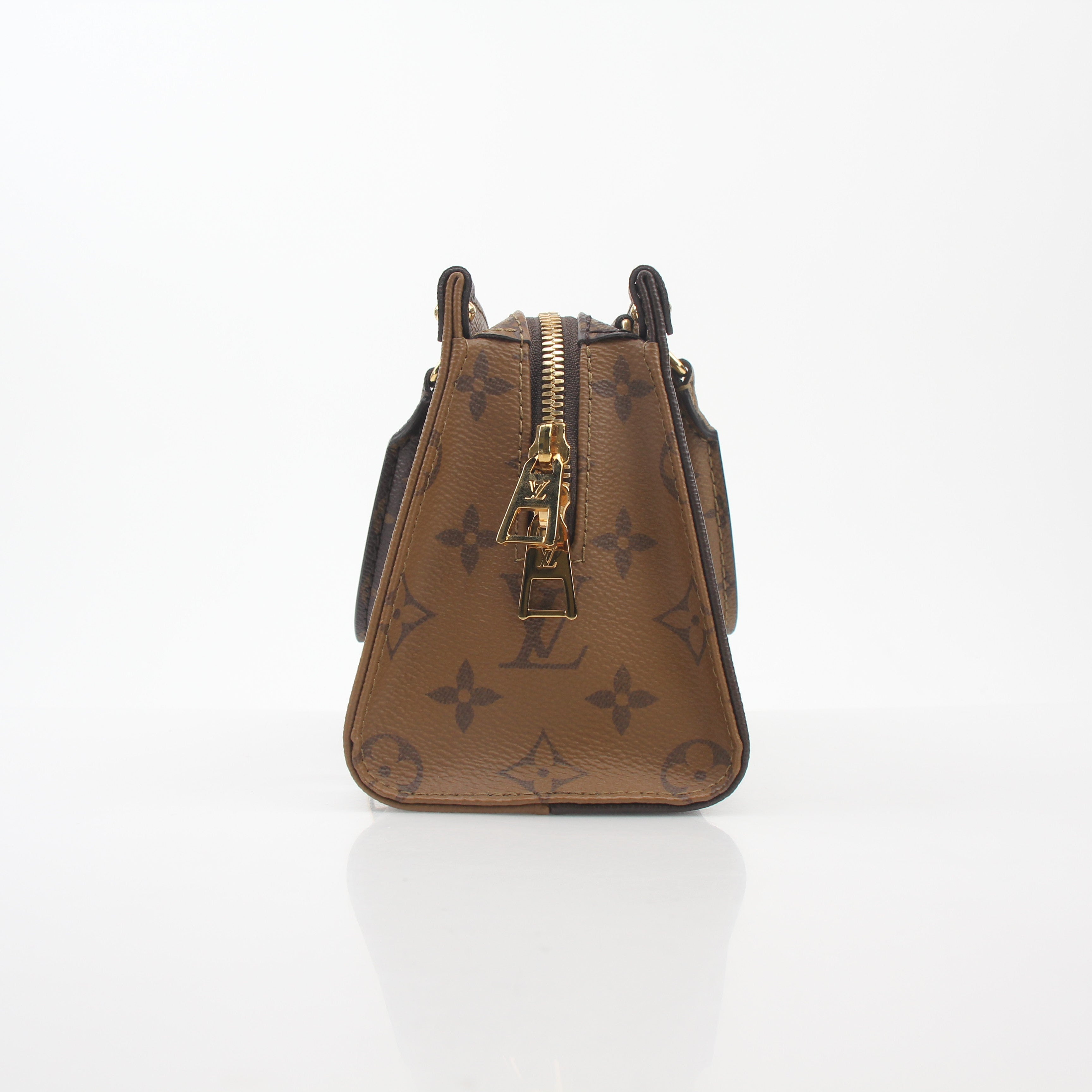 Louis Vuitton brown Monogram OnTheGo East West handbag with gold-tone hardware, featuring a spacious design and top handles.