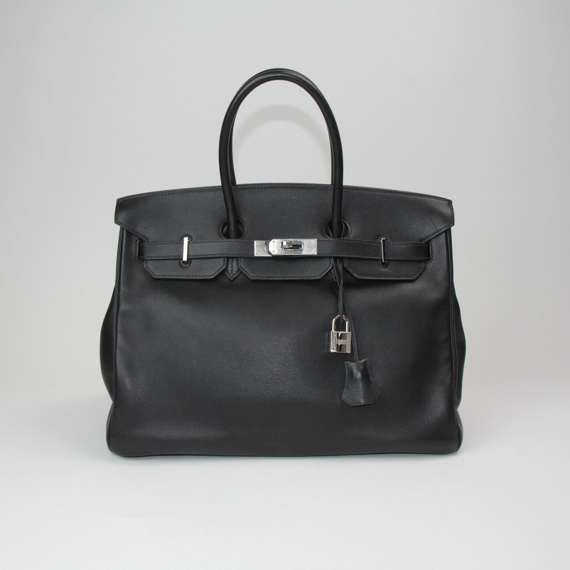 Gold & Beyond Hermès Birkin 35 handbag in classic leather with gold hardware, featuring a spacious interior and elegant design.
