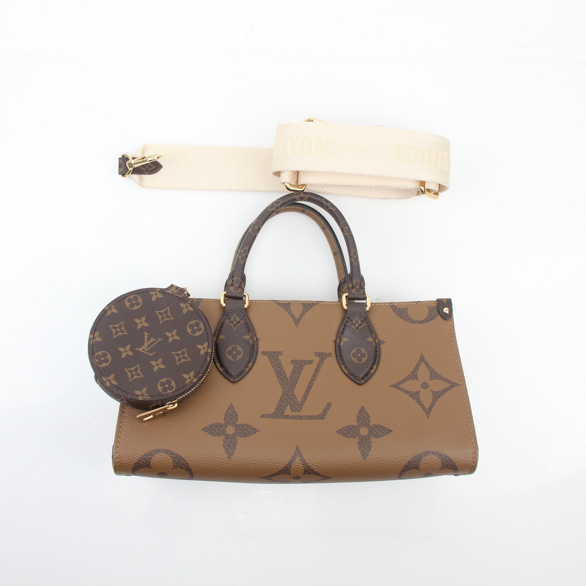Louis Vuitton Brown Monogram OnTheGo East West handbag with gold accents, featuring a spacious design and structured silhouette.