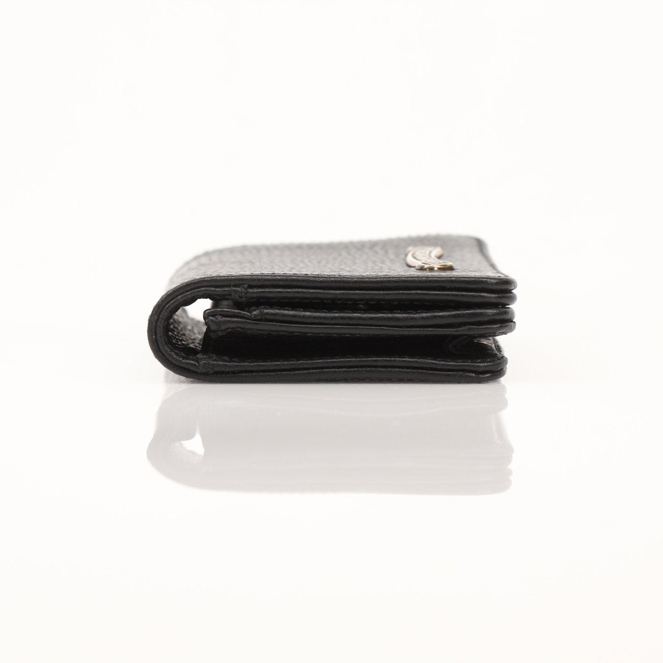 Chrome Hearts card wallet with chrome hardware detailing, black leather exterior, and multiple card slots.