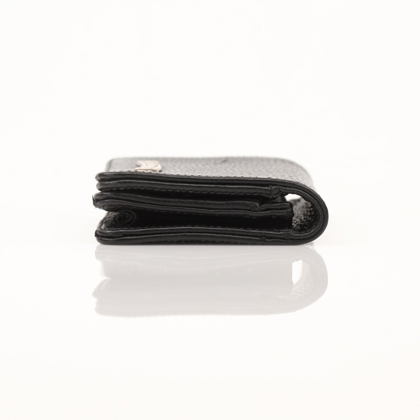 Chrome Hearts chrome card wallet with distinctive logo and sleek design, featuring multiple card slots and a polished finish.