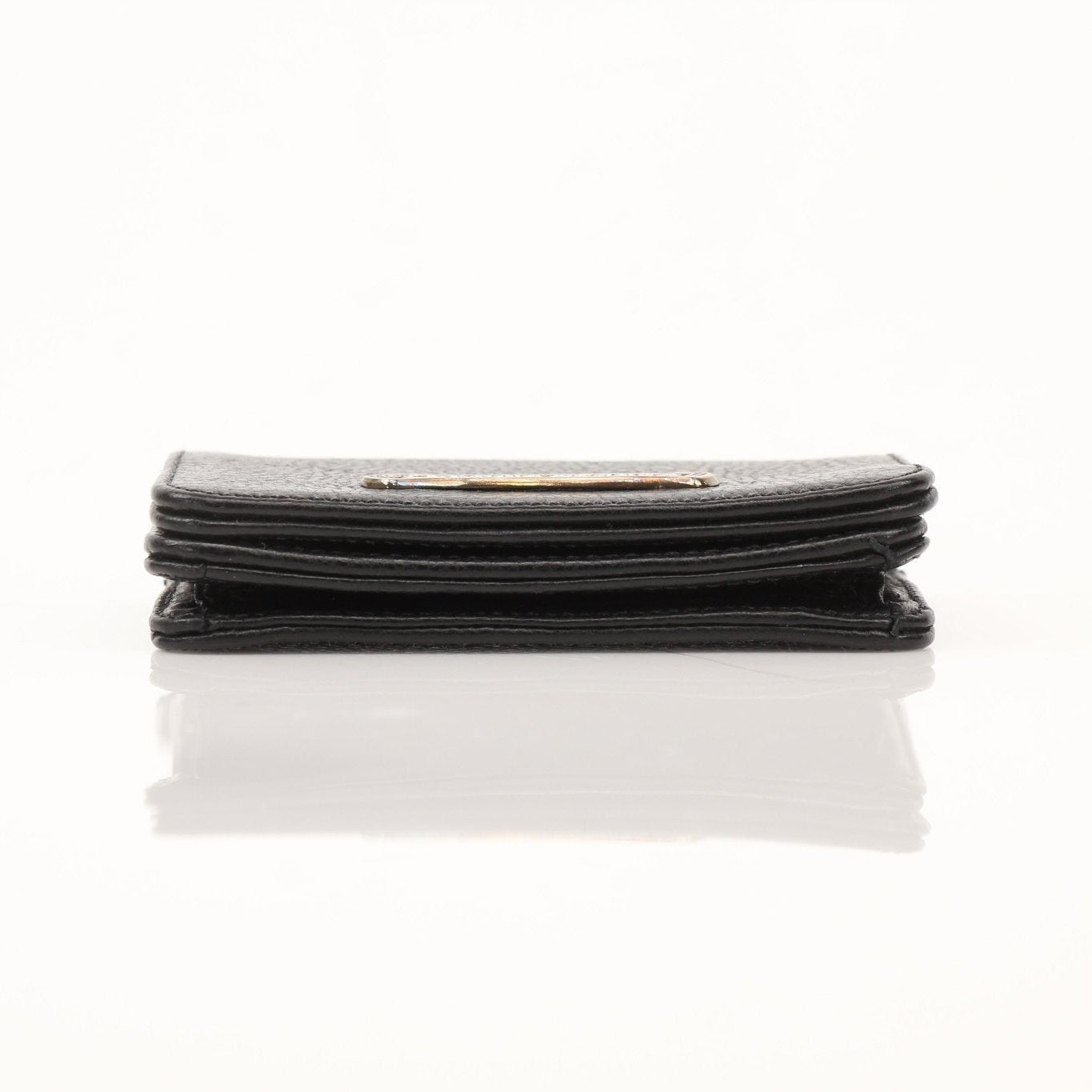 Chrome Hearts leather card wallet with metal logo detail, compact and sleek design perfect for everyday use.