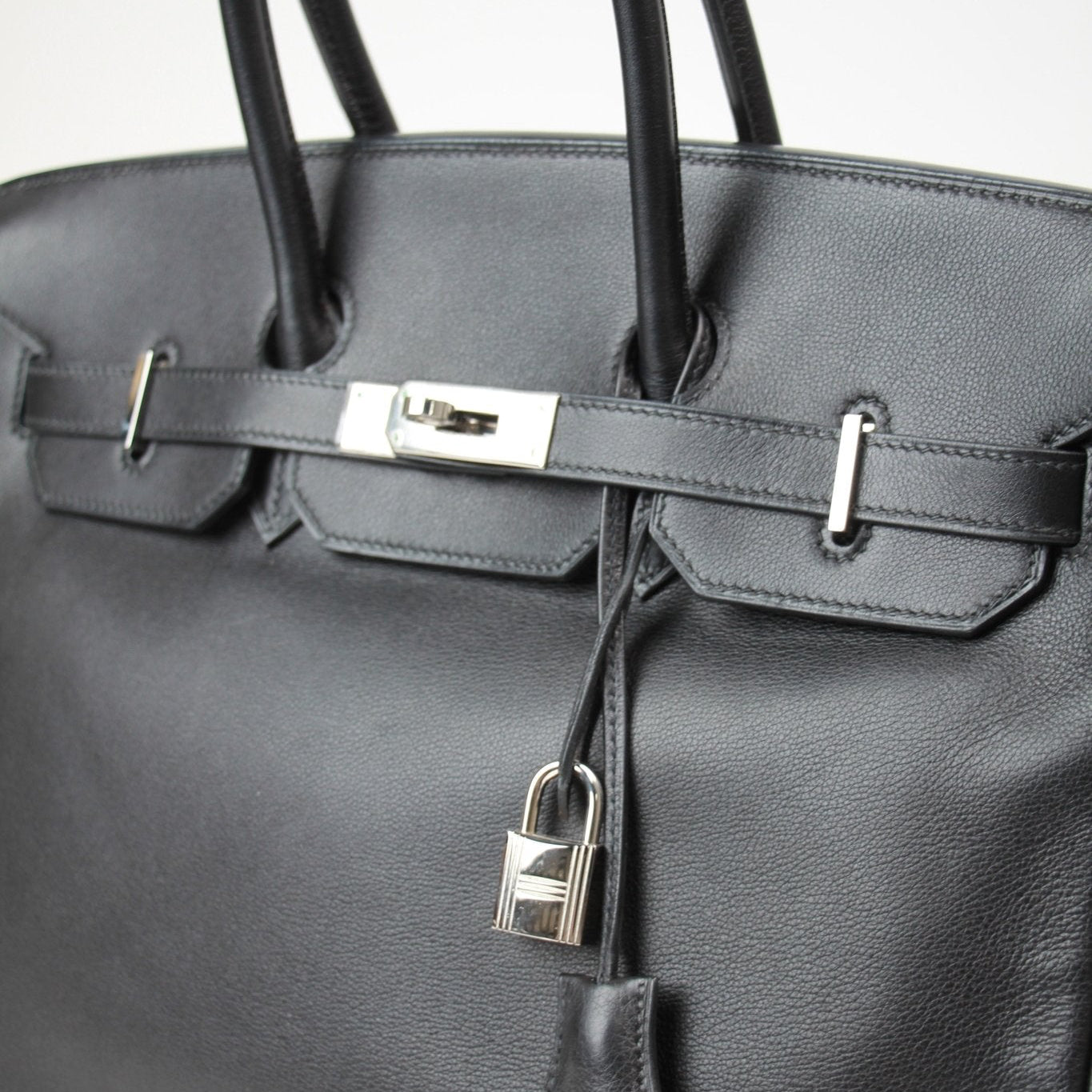 Hermès Birkin 35 handbag in rich leather with gold hardware, showcasing elegant design and luxurious craftsmanship.