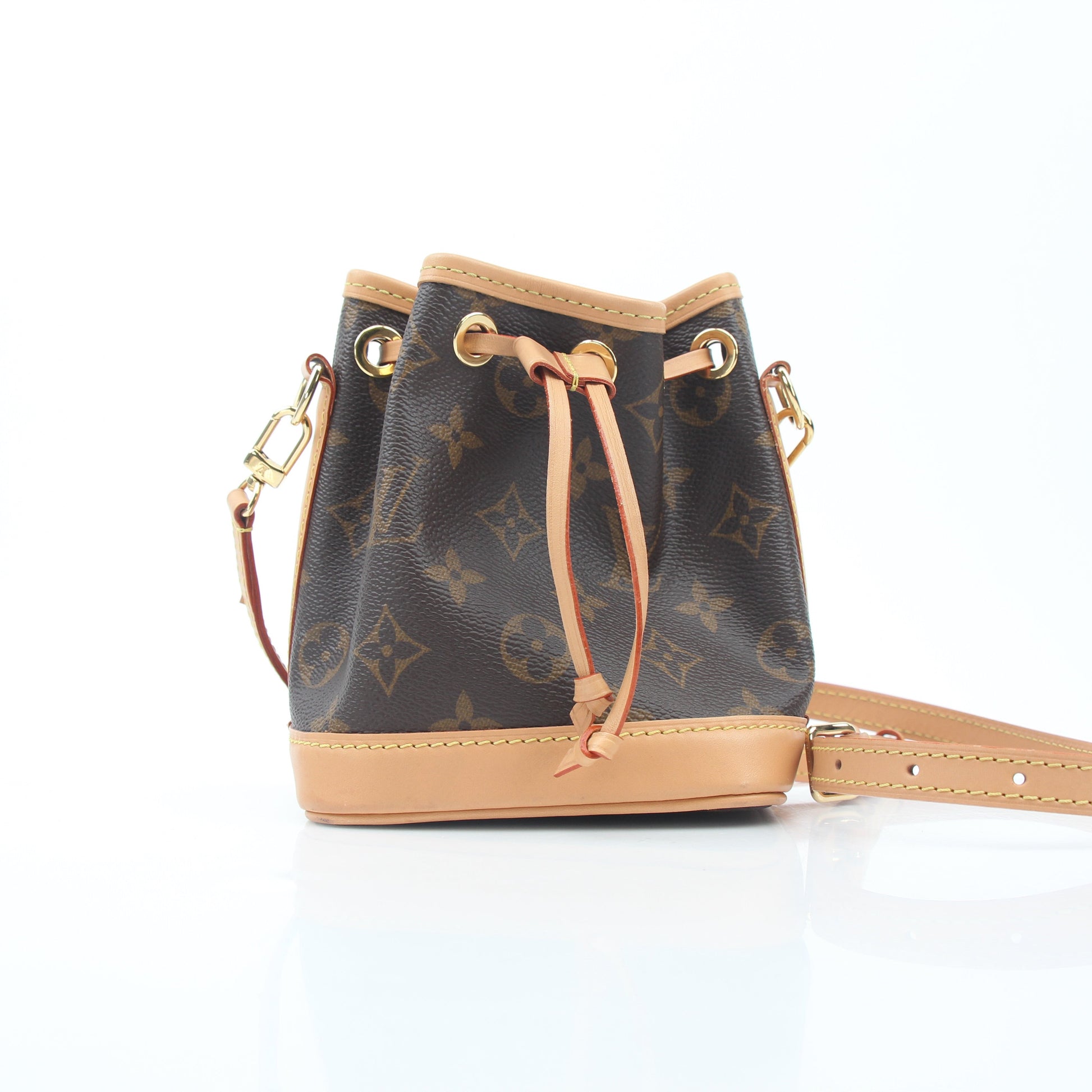 Louis Vuitton Monogram Nano Noé bucket handbag by Gold & Beyond, showing the compact monogram canvas bag with leather drawstring closure.