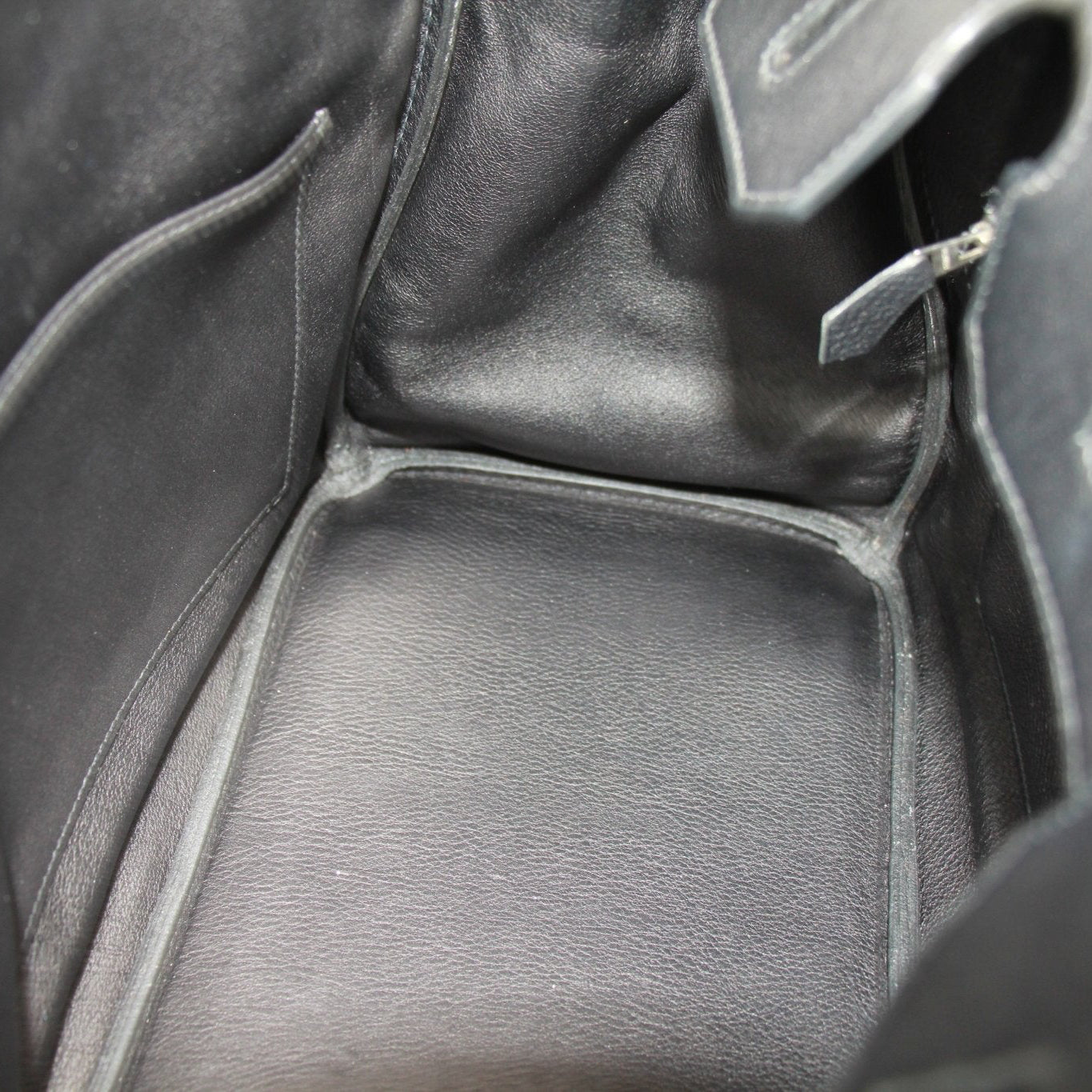 Gold &amp; Beyond Hermès Birkin 35 handbag in classic leather with polished hardware and spacious interior, elegantly displayed.