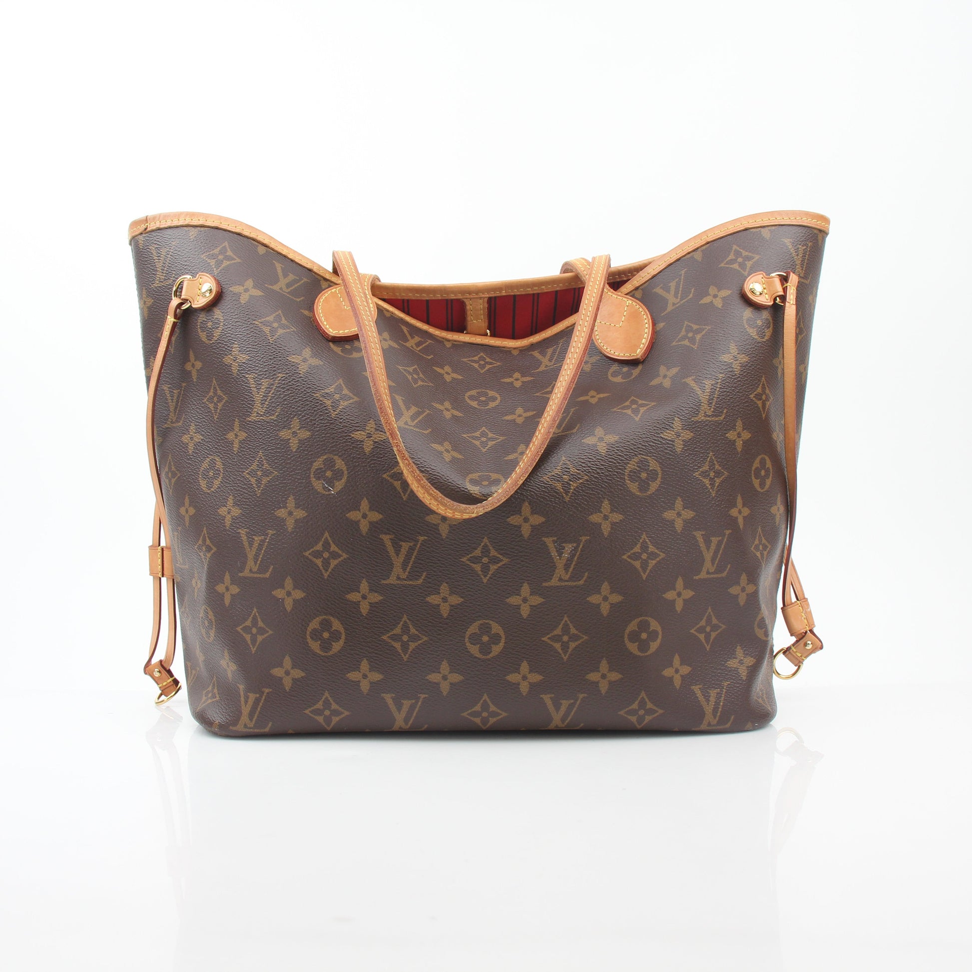 Louis Vuitton Monogram Neverfull MM tote handbag with leather handles and spacious interior, displayed on a neutral background.