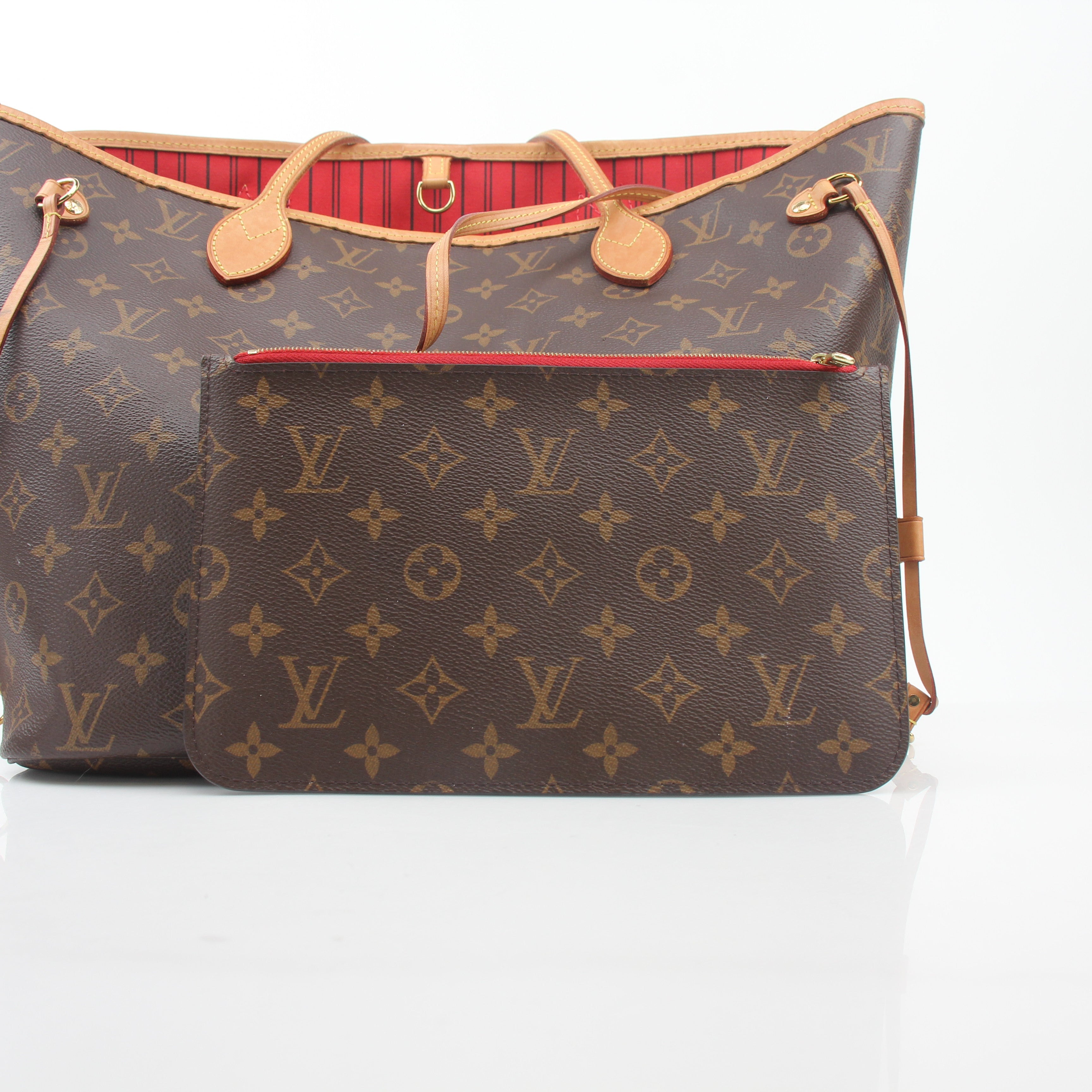 Louis Vuitton Monogram Neverfull MM tote handbag with beige canvas and leather trim, displayed against a white background.