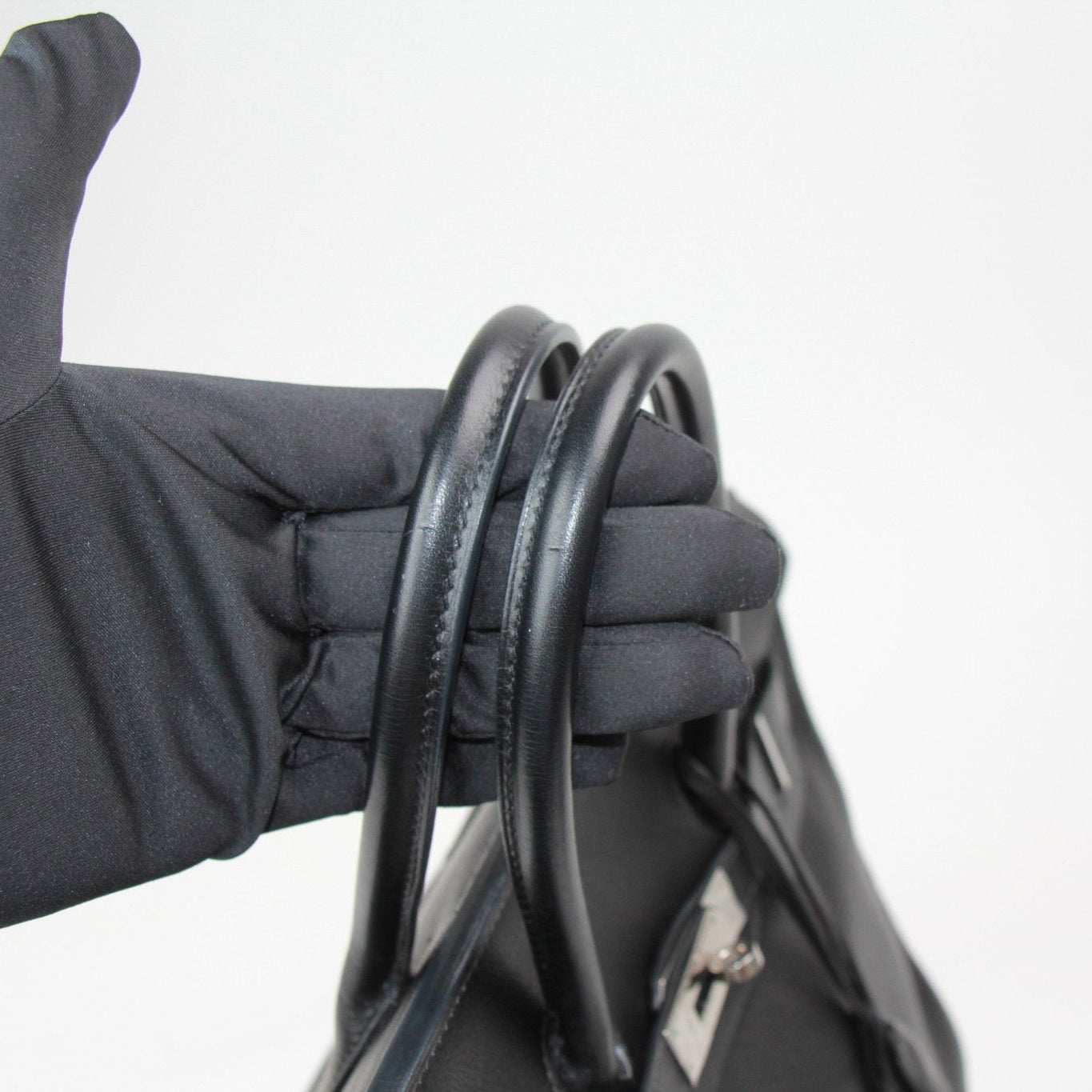 Hermès Birkin 35 handbag in elegant design, featuring luxurious leather and gold-tone hardware.