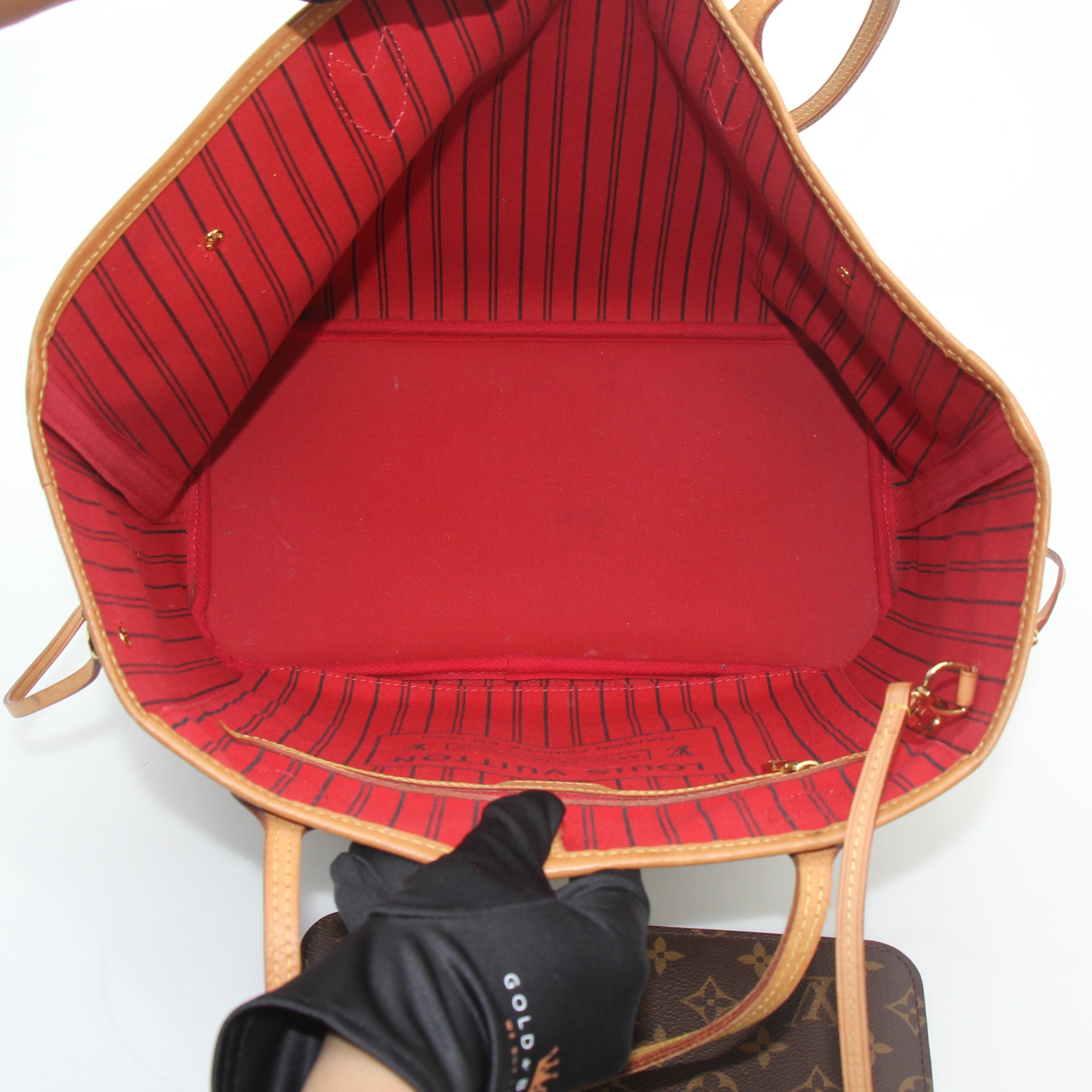 Louis Vuitton Monogram Neverfull MM tote handbag with leather trim and shoulder straps, featuring the iconic LV monogram pattern.