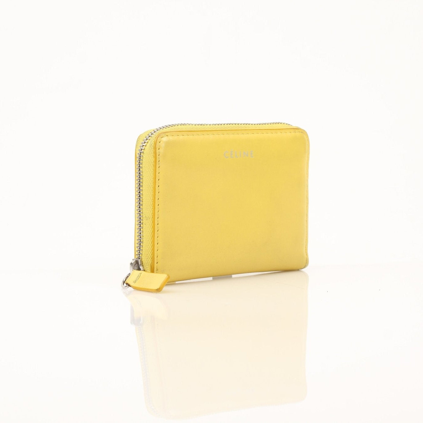 Gold & Beyond Celine Compact Zipped Wallet showing black leather exterior with silver zipper and multiple card slots.