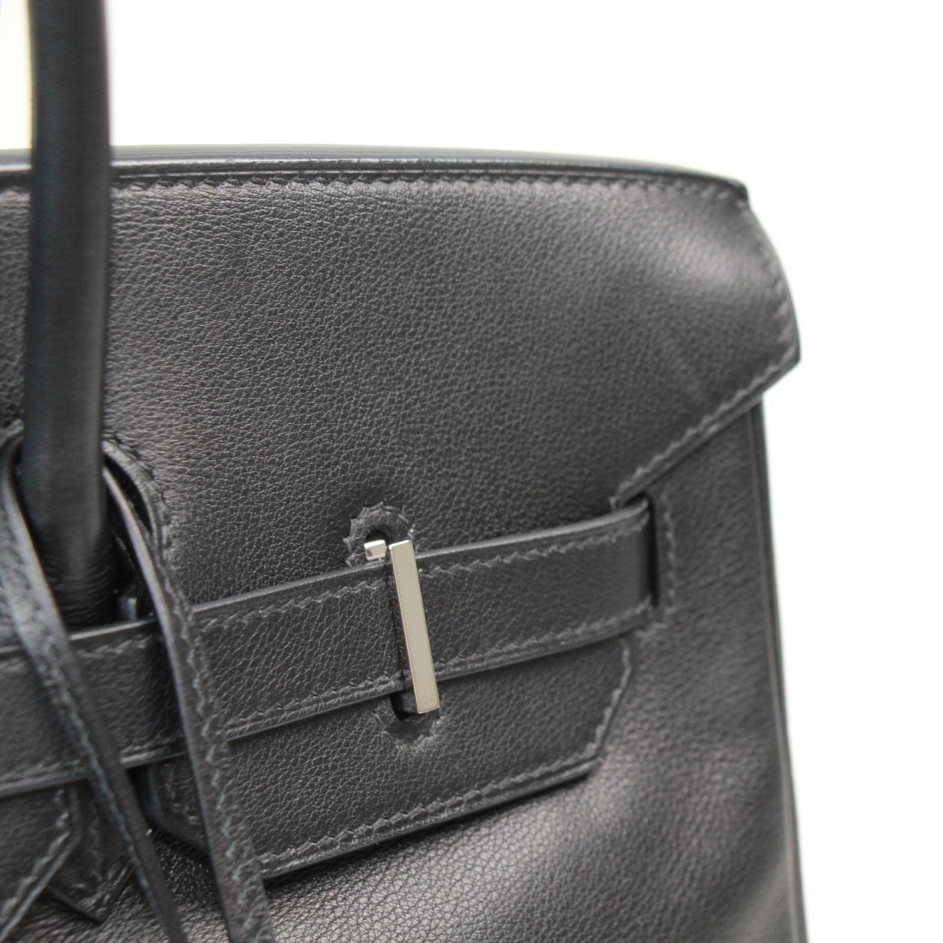 Hermès Birkin 35 handbag in luxurious leather with gold hardware, showcasing its elegant design and craftsmanship.