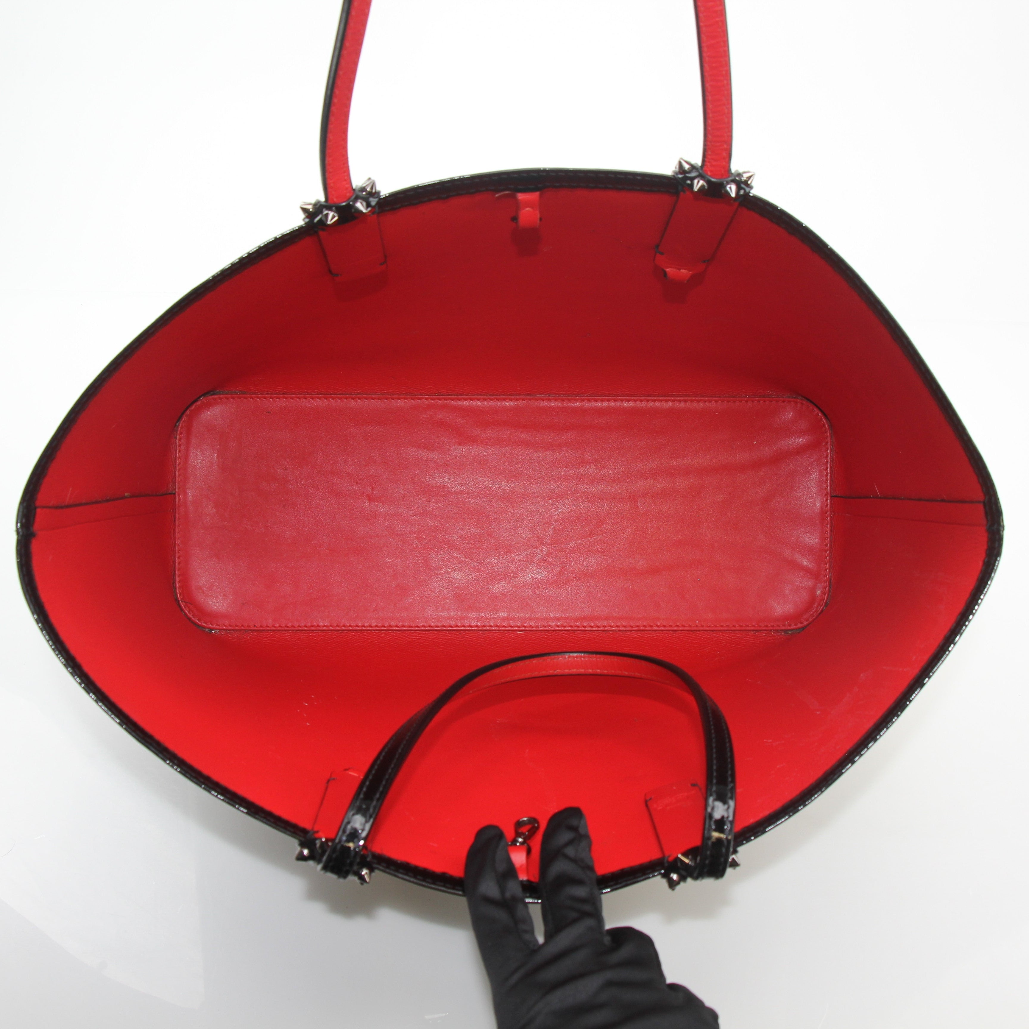 Christian Louboutin black patent leopard print Cabata tote handbag with gold accents and structured design.