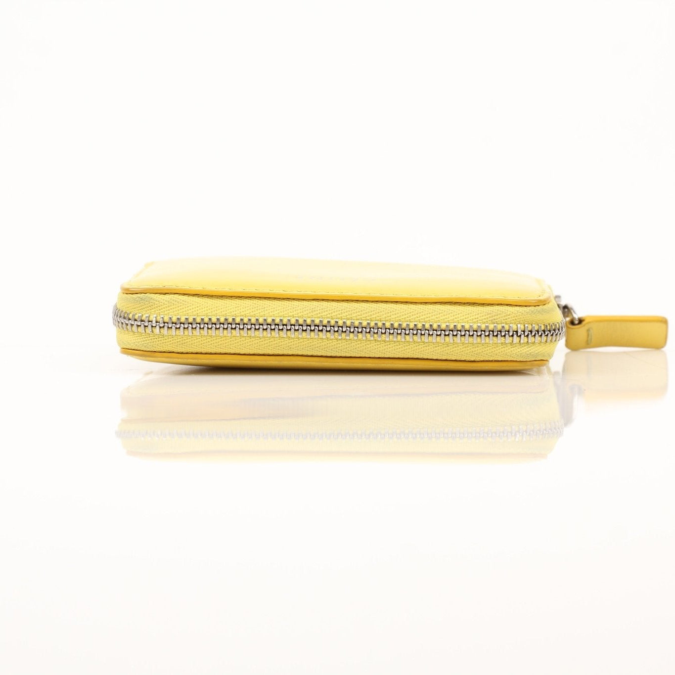 Gold & Beyond Celine Compact Zipped Wallet with gold zipper and leather exterior, showcasing a sleek, stylish wallet design.