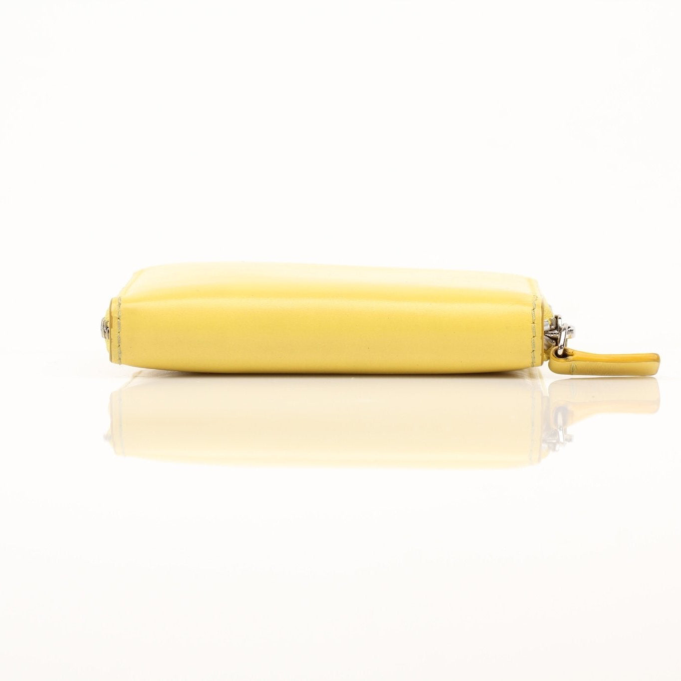 Gold & Beyond Celine Compact Zipped Wallet with gold-tone zipper and sleek leather finish, close-up view of the wallet's design.