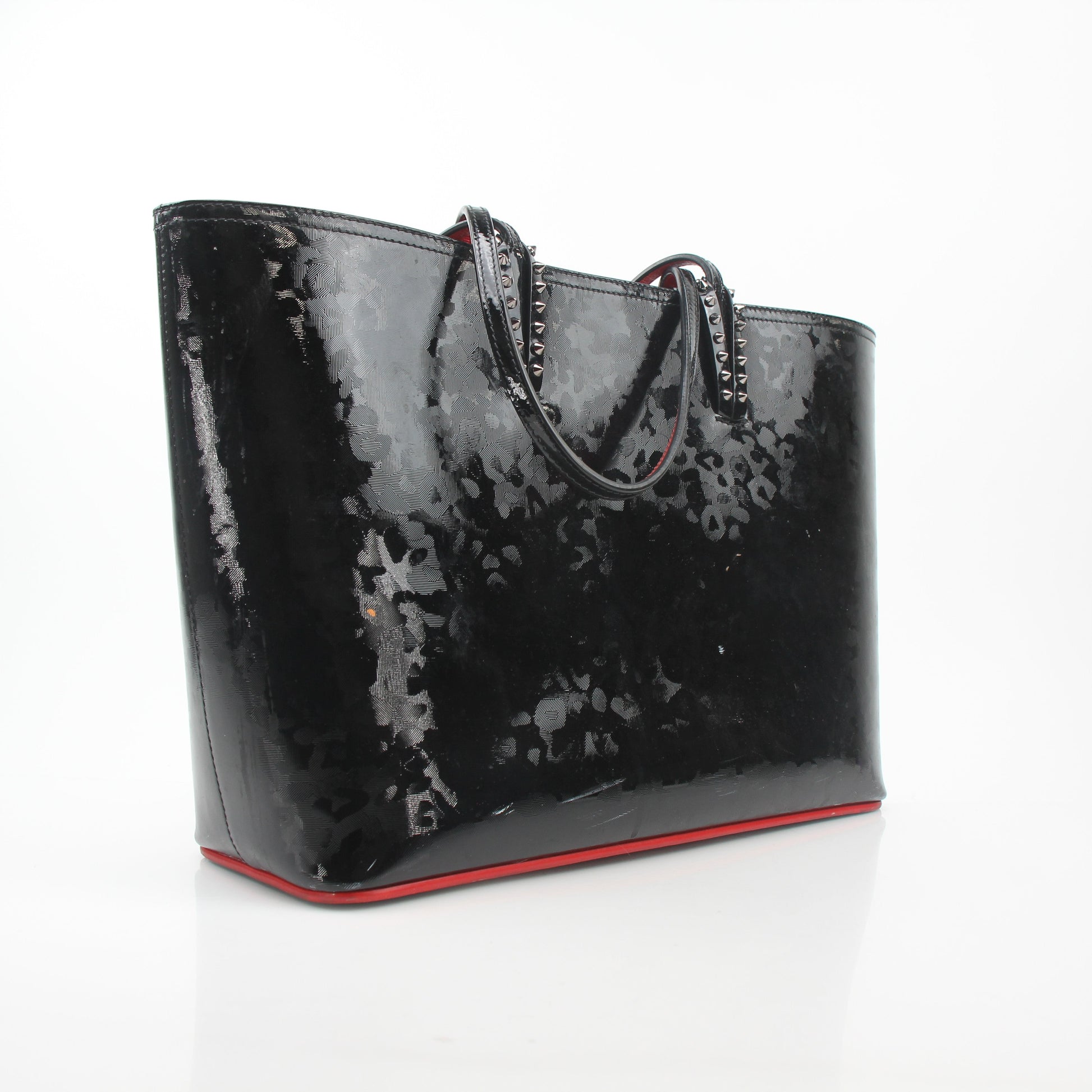 Christian Louboutin black patent leopard print Cabata tote handbag with gold accents, showcasing its luxurious design and spacious interior.