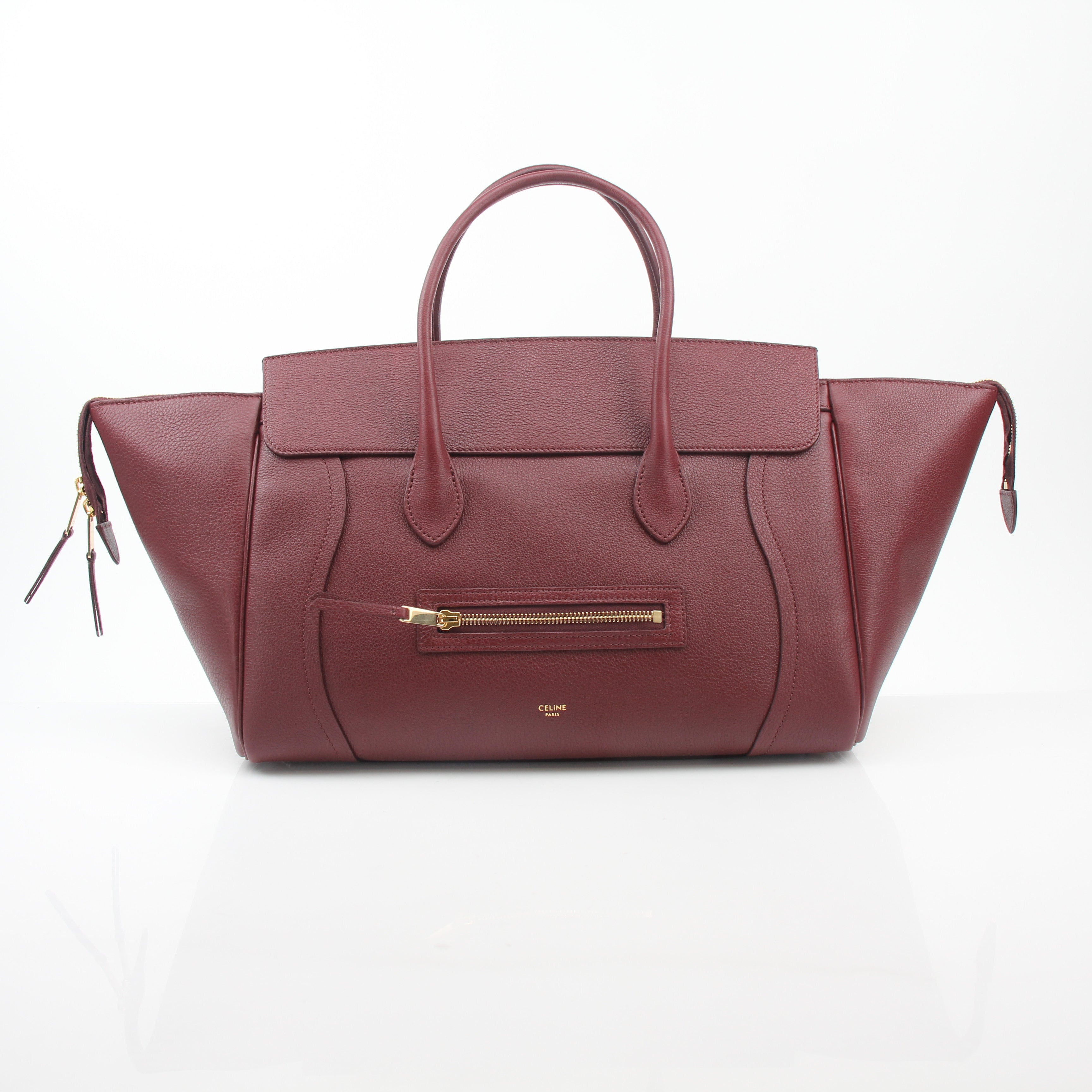 Gold & Beyond Celine Burgundy shoulder luggage tote handbag with structured design and top handles, displayed on a neutral background.