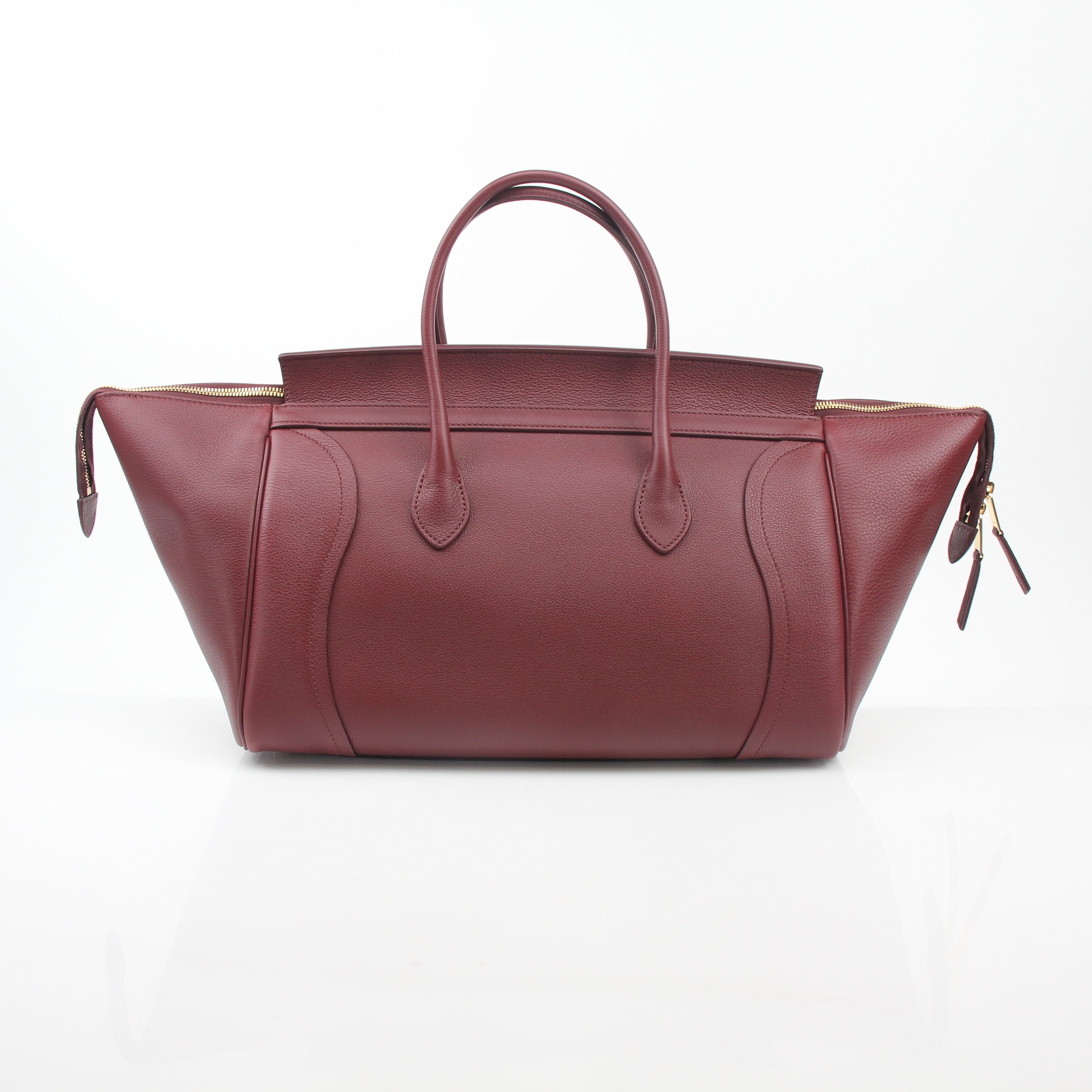 Gold & Beyond Celine Burgundy shoulder luggage tote handbag with top handles and spacious interior, stylish and functional for daily use.