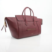 Gold & Beyond Celine Burgundy shoulder luggage tote handbag with leather handles and spacious interior.